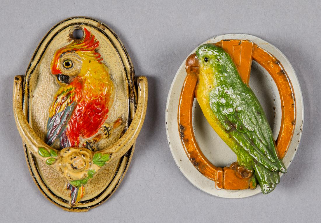 Two cast iron parrot door knockers: Two cast iron parrot door knockers, one Judd & Co., 3 1/4'' h., the other 3 3/4'' h.