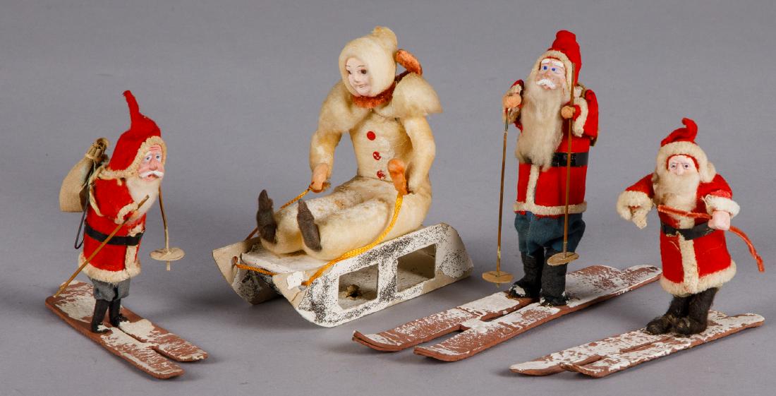 Three Japanese composition Santa Claus on ski's, etc.: Three Japanese composition Santa Claus on ski's, together with a spun cotton boy on sled, 5 1/8'' h.