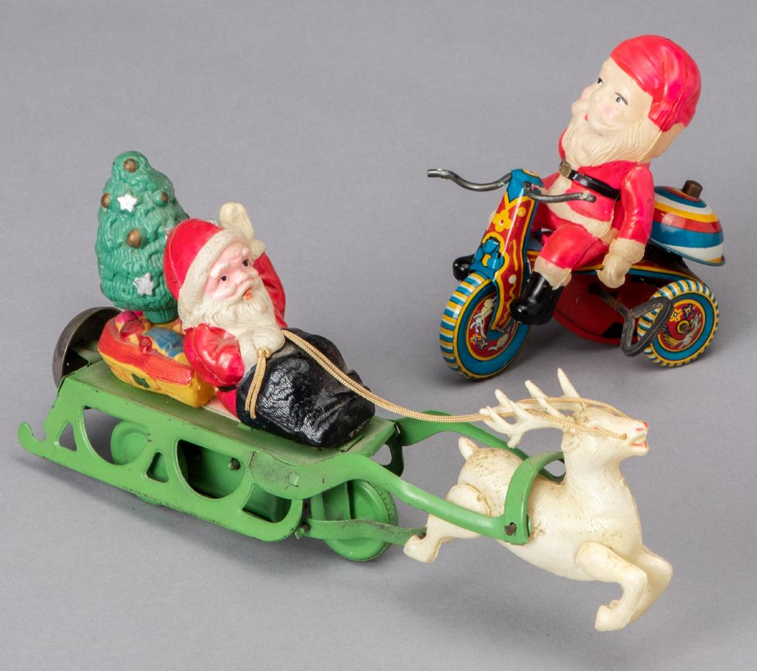 Two celluloid wind-up Santa Claus toys: Two celluloid wind-up Santa Claus toys, longest - 8 1/4''.