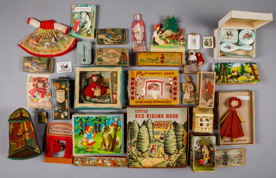 Group of Little Red Riding Hood collectibles: Group of Little Red Riding Hood collectibles, to include puzzle blocks, a wood thermometer, Lion Coffee advertising, walking doll box, corner shelf, books, puzzles, and Knickerbocker doll dress, etc.