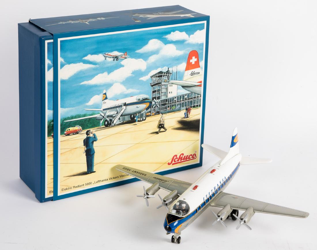 Schuco Elektro Radiant 5600 airplane: Contemporary Schuco tin lithograph battery operated Elektro Radiant 5600 airplane, in the original box, 18 1/2'' wingspan. Provenance: Estate of Jonathan Barrow, Los Angeles, California.