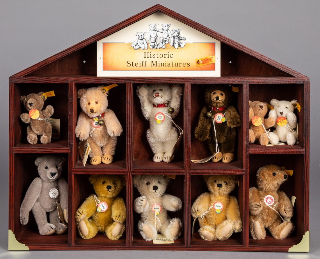 Eleven Historic Steiff Miniatures teddy bears: Collection of eleven Historic Steiff Miniatures teddy bears, in display case, case - 18 1/2'' h., 22 1/2'' w.