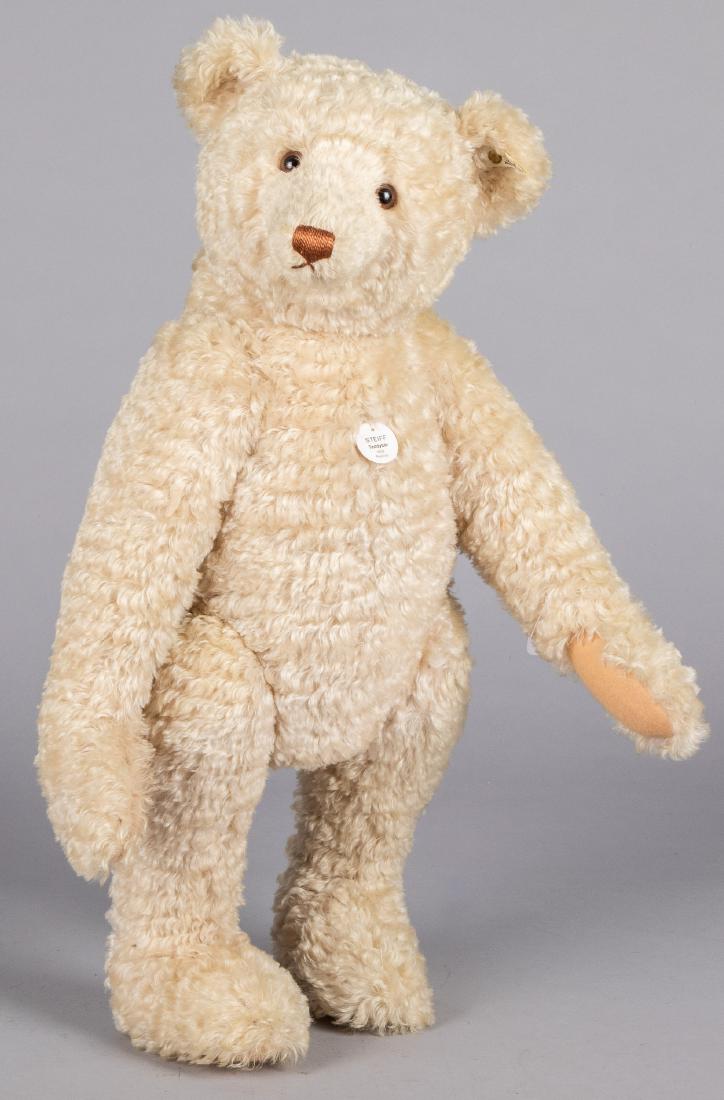 Large Steiff mohair teddy bear: Large Steiff mohair teddy bear, a 1908 replica, with button and ribbon, 26'' h.