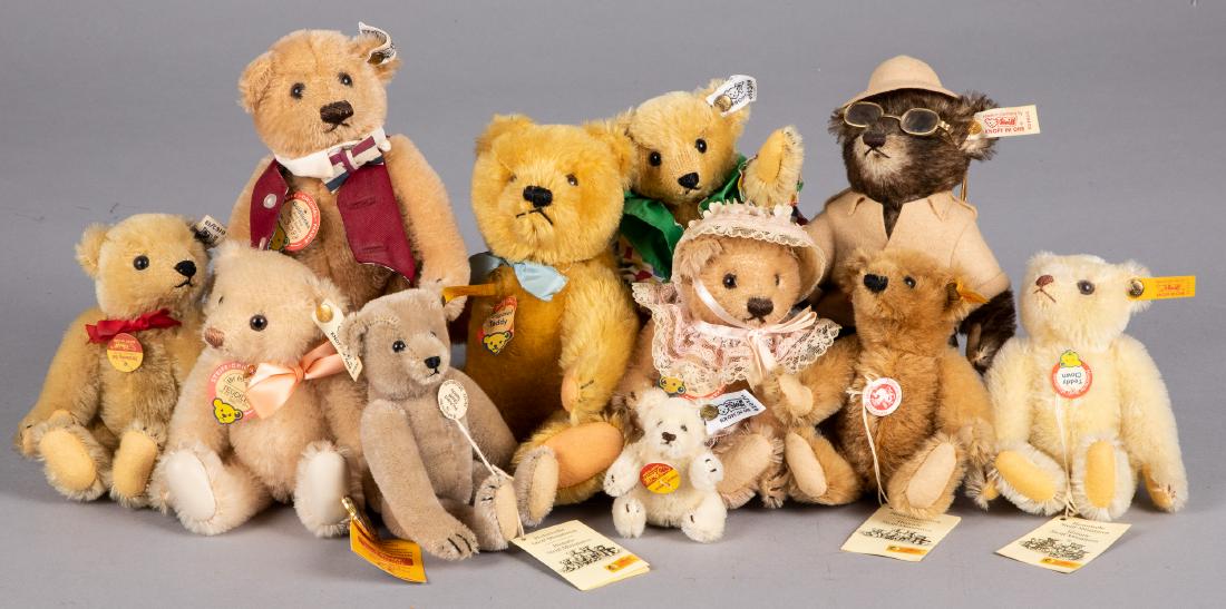 Eleven small Steiff mohair teddy bears: Eleven small Steiff mohair teddy bears, with buttons and ribbons, tallest - 9''.
