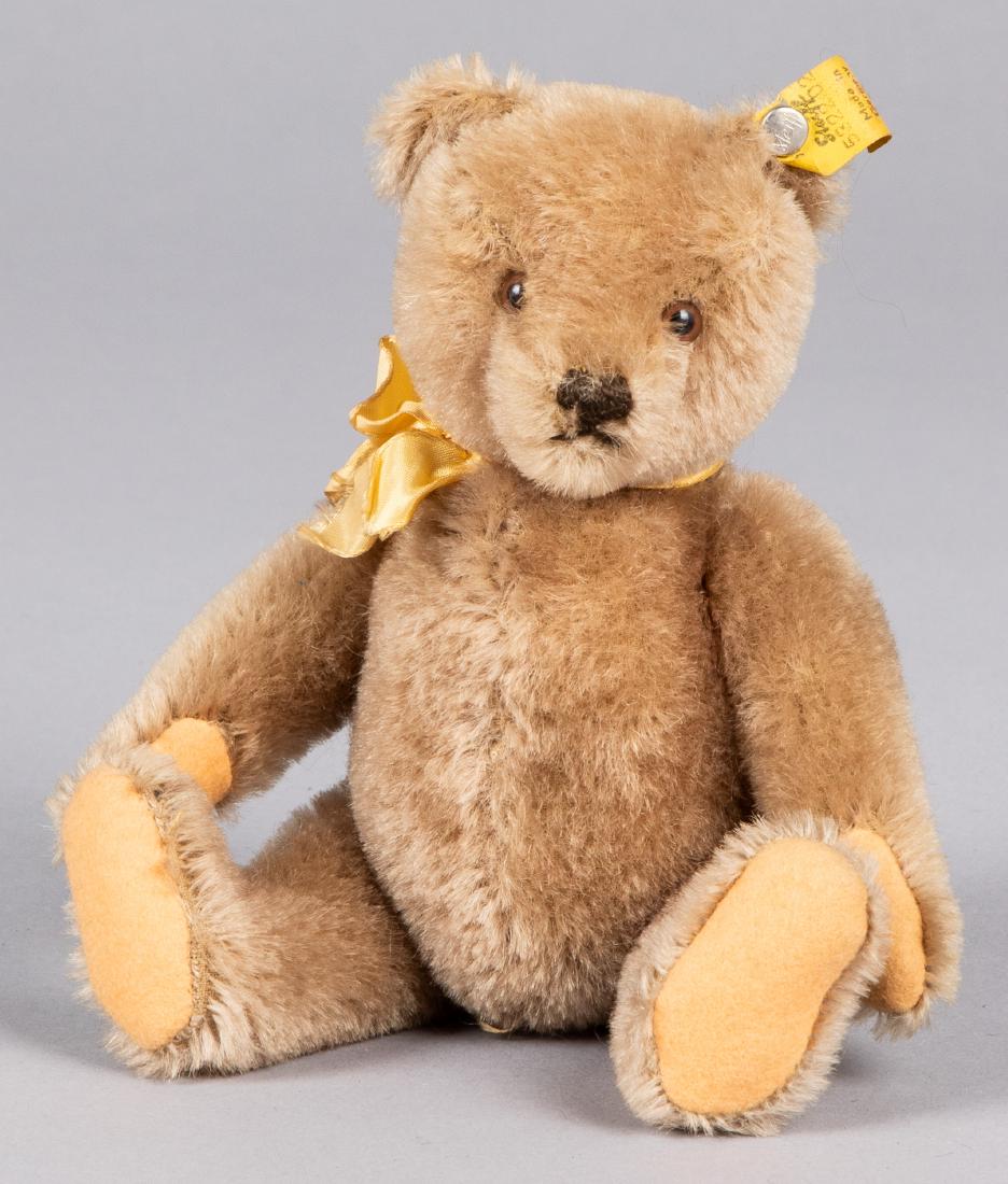 Steiff mohair teddy bear: Steiff mohair teddy bear, ca. 1950's, with glass eyes, sewn claws and ear button with ribbon, 7 1/2'' h.