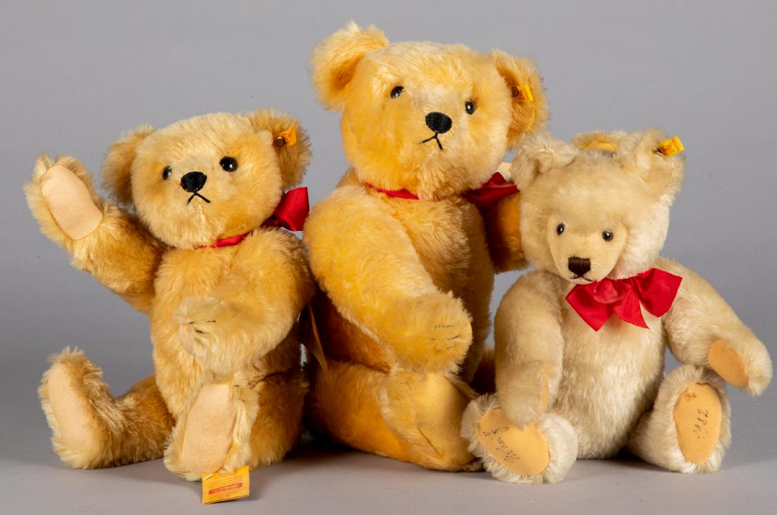 Three Steiff mohair teddy bears: Three Steiff mohair teddy bears, with ear buttons and ribbons, to include two 1909 replicas and one dated 1982, tallest - 20''.
