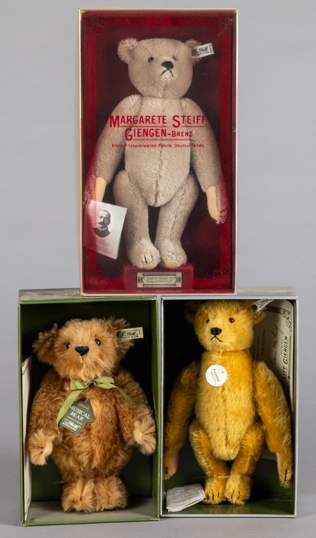 Three Steiff mohair teddy bears: Three Steiff mohair teddy bears, with original boxes, having ear buttons and ribbons, limited editions to include Somersault Teddy, Harrods Musical Bear and a 1902 replica, tallest - 12''.