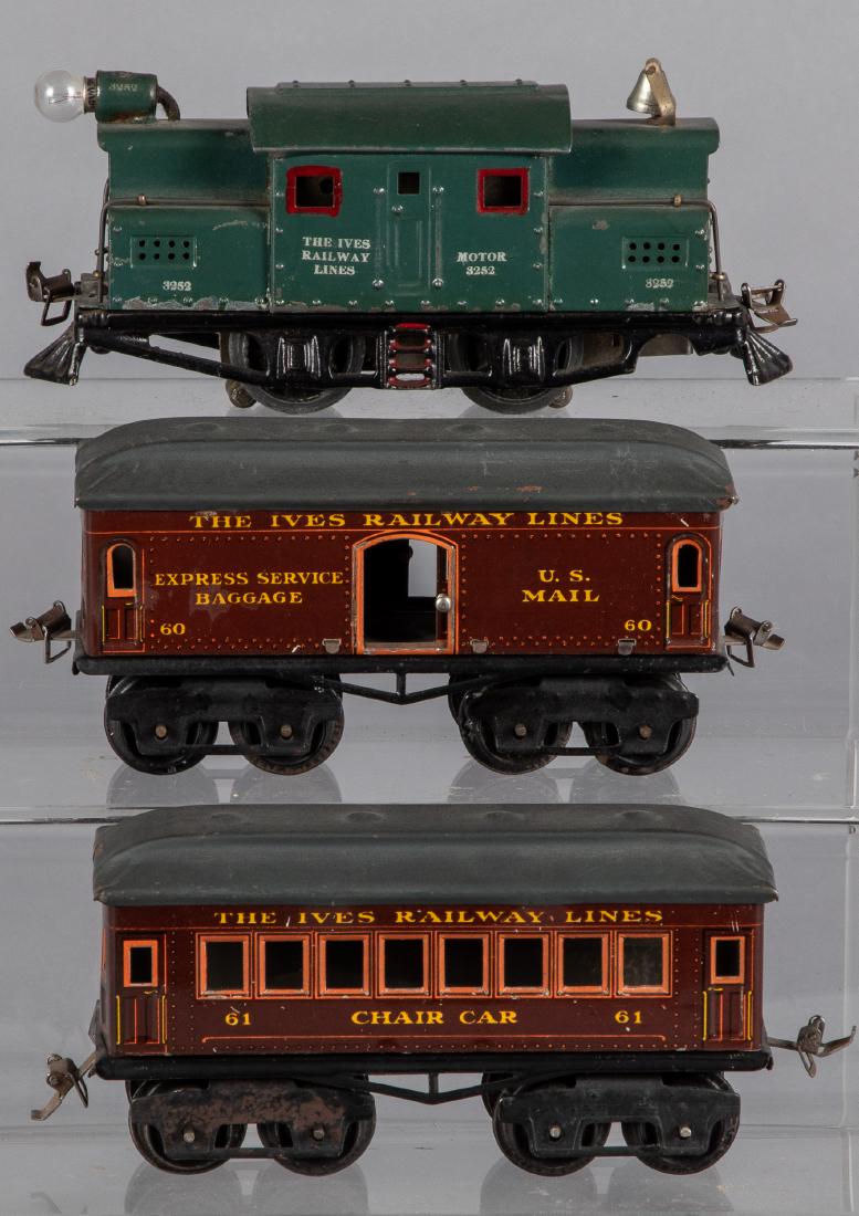 Ives tin lithograph three-piece train set: Ives tin lithograph three-piece train set, 0 gauge, to include #3252 locomotive, a #61 chair car and a #60 baggage/mail car, engine - 7 3/4'' l.