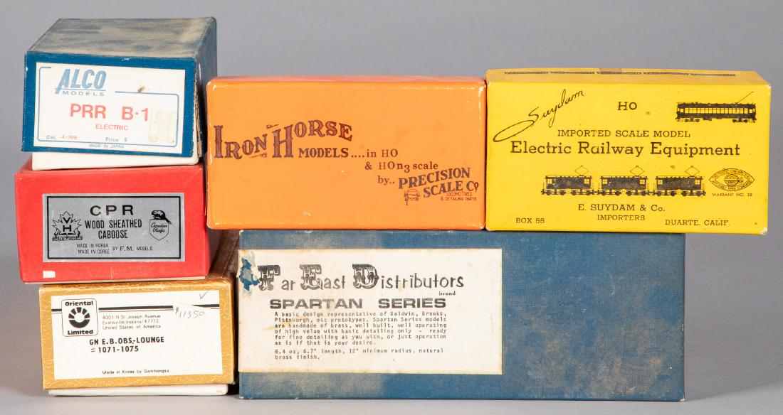 Six brass HO scale train cars and locomotives: Six brass HO scale train cars and locomotives, in the original boxes, HO scale, to include Iron Horse Models, Oriental Limited, Alco, CPR wood sheathed caboose, Suydam and FED Sparton series, longest 