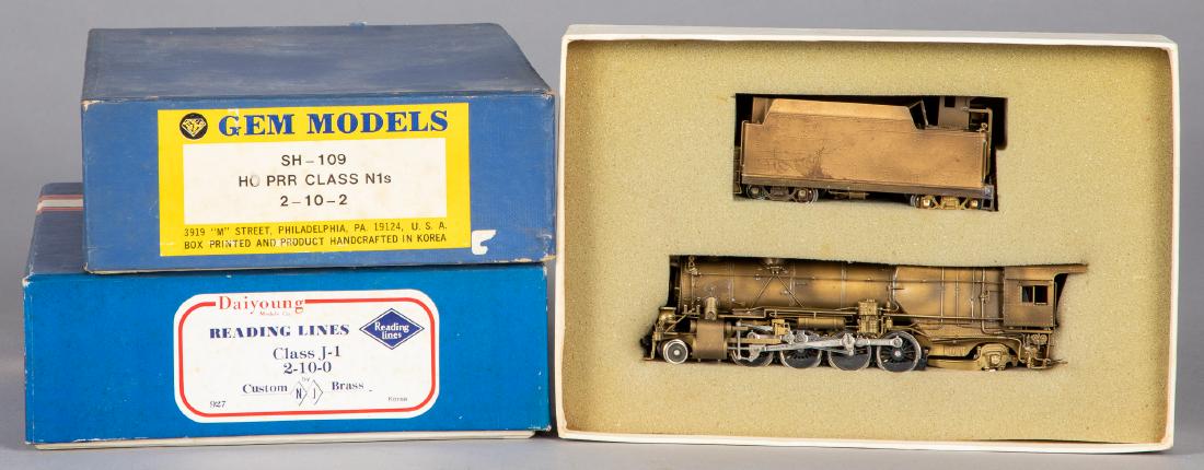 Three brass HO scale train cars and locomotives: Three brass HO scale train cars and locomotives, in the original boxes, to include Reading Lines 2-10-0, Gem Models, SH-109 2-10-2, and a United PRR 2-8-2, longest - 8 1/4''.
