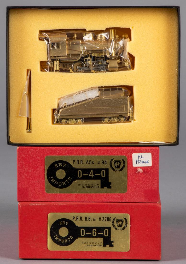 Two Key Imports brass HO scale train locomotives: Two Key Imports brass HO scale train locomotives, in the original boxes, to include a PRR A5s #94 0-4-0 and a PRR B-6 #2786 0-6-0, 6'' l.