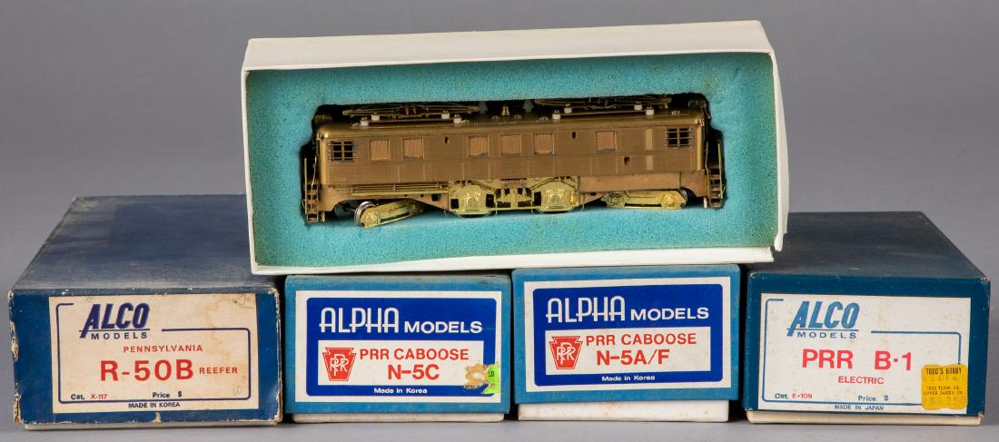 Five Alpha and Alco brass HO train cars: Five Alpha and Alco brass HO train cars, in the original boxes, to include a PRR N-5C caboose, a PRR N-5A/F caboose, a PRR B-1 electric, a Pennsylvania O-1C and a Pennsylvania R-50B reefer, longest - 