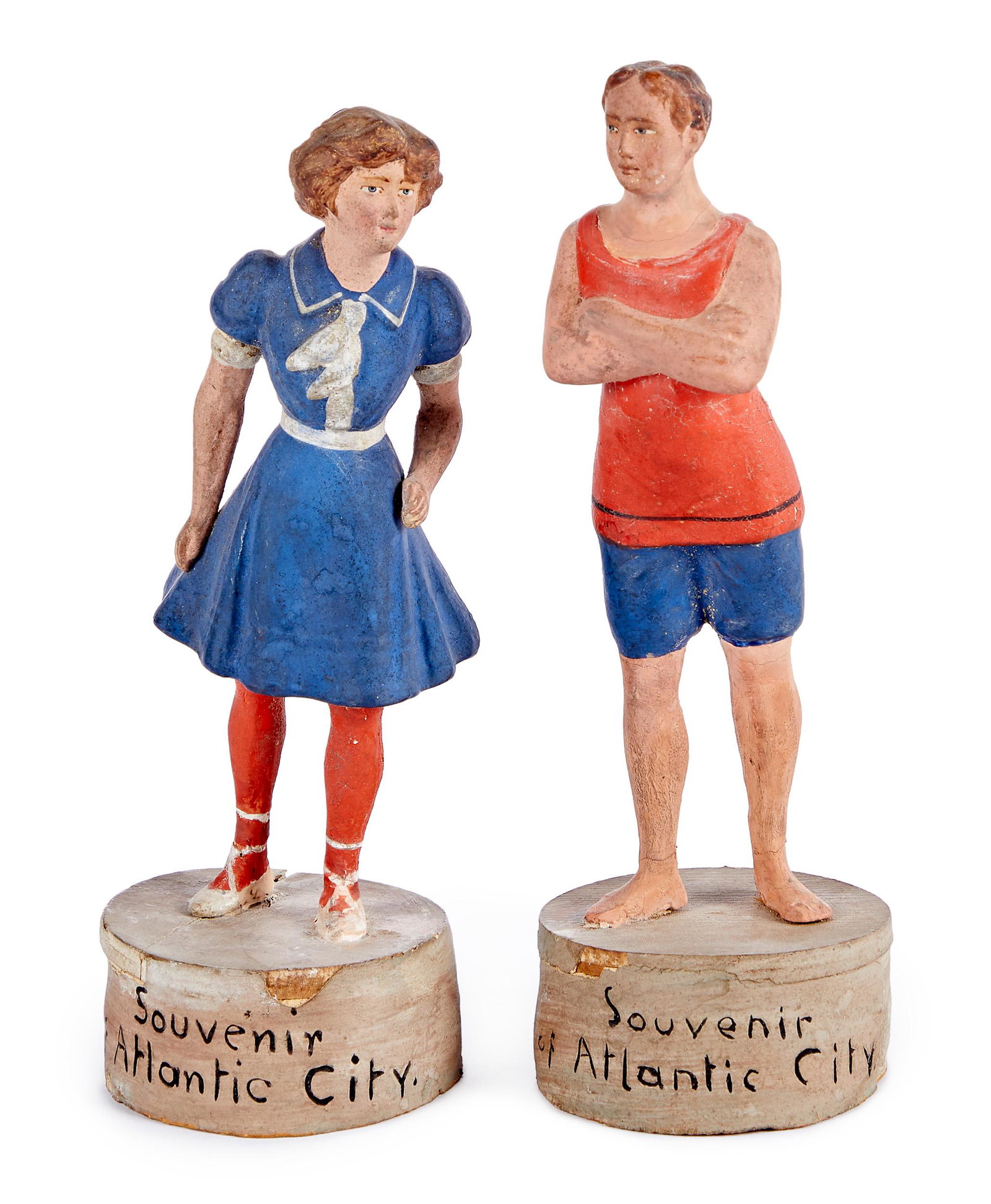 Two early Atlantic City souvenir figures: Two early composition Atlantic City souvenir figures, of a man and woman in beach attire, 7 1/4'' h.