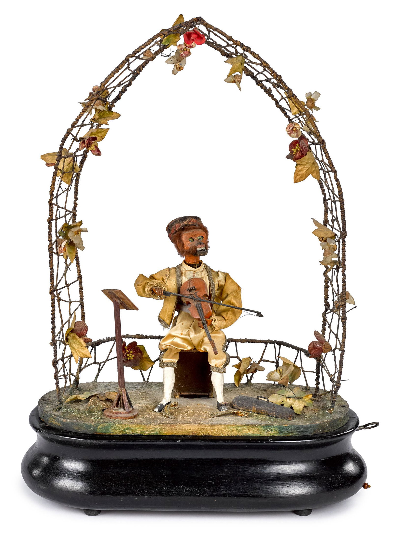 Phalibois monkey violinist automaton: Phalibois monkey violinist clockwork automaton, seated under a trellis, with music stand and violin case at his feet, plays violin as head moves side to side and up and down 25 1/4'' h., 18 1/2'' w.