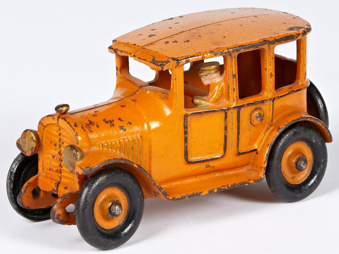 Hubley yellow cab with integral driver: Hubley cast iron yellow cab, with integral driver, 6 1/4'' l. Provenance: Collection of Bill and Stevie Weart.