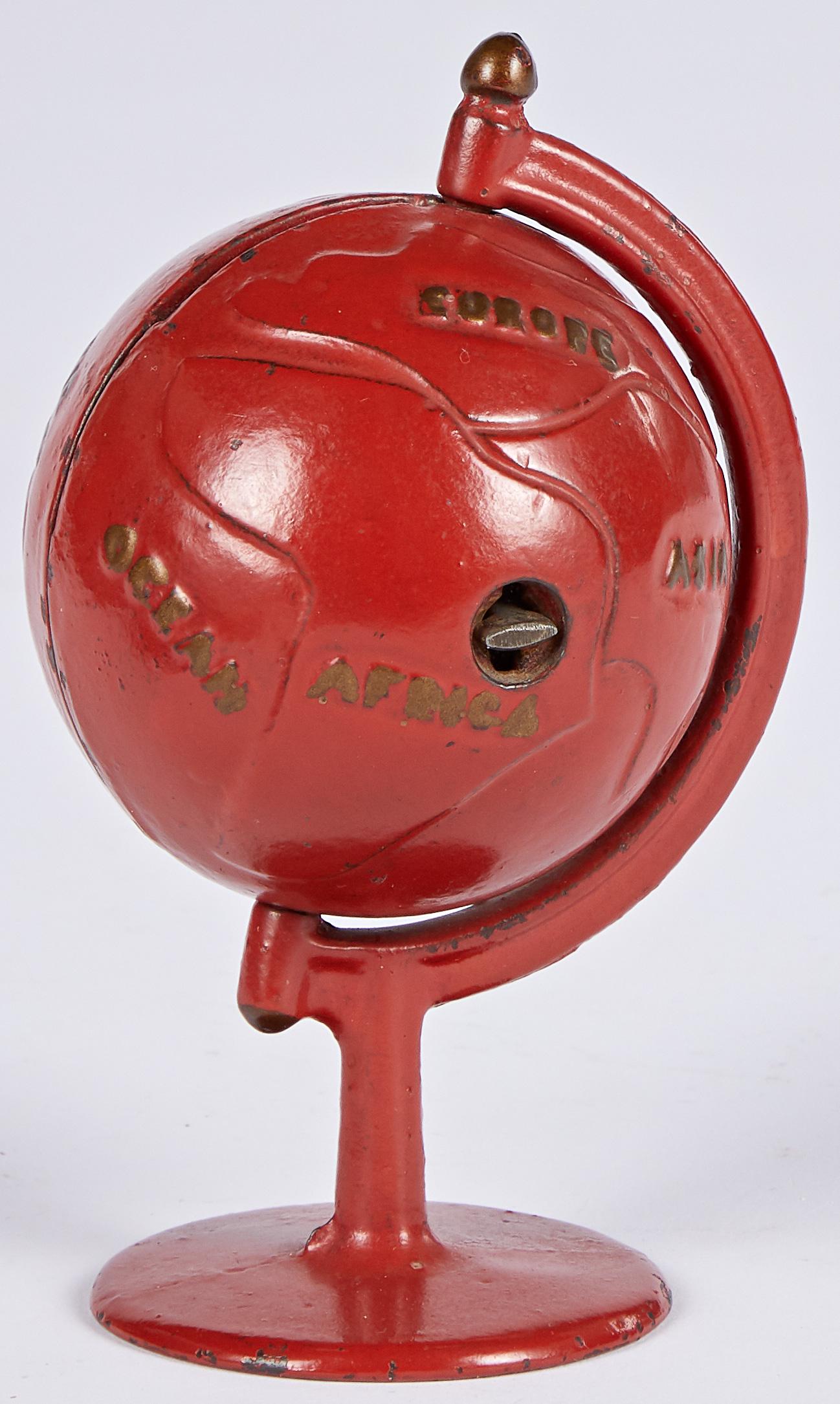 Grey Iron cast iron globe on arc still bank: Grey Iron cast iron globe on arc still bank, 5 1/4'' h. Provenance: Collection of Bill and Stevie Weart.