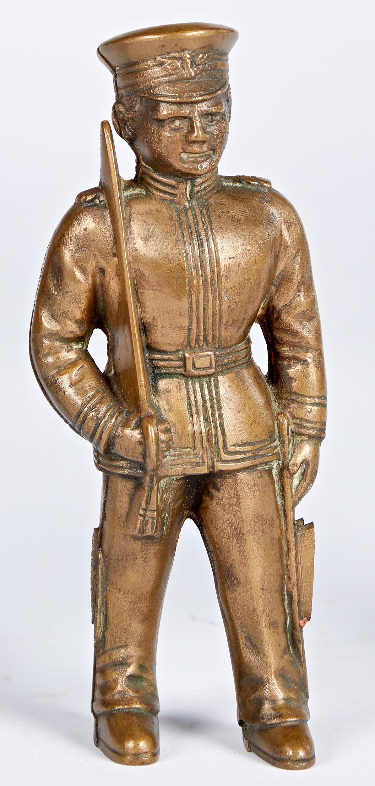 Hubley cast brass officer/cadet still bank patter: Hubley cast brass officer/cadet still bank pattern, 5 3/4'' h. Provenance: Collection of Bill and Stevie Weart.