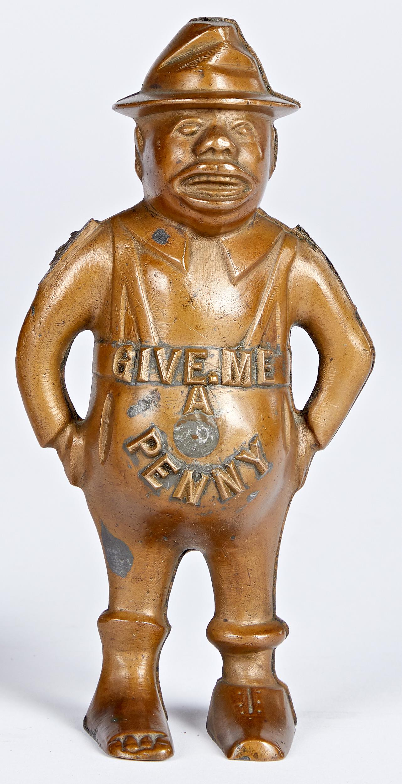 Hubley cast Give me a Penny still bank pattern: Hubley cast brass Give me a Penny still bank pattern, 5 3/4'' h. Provenance: Collection of Bill and Stevie Weart.