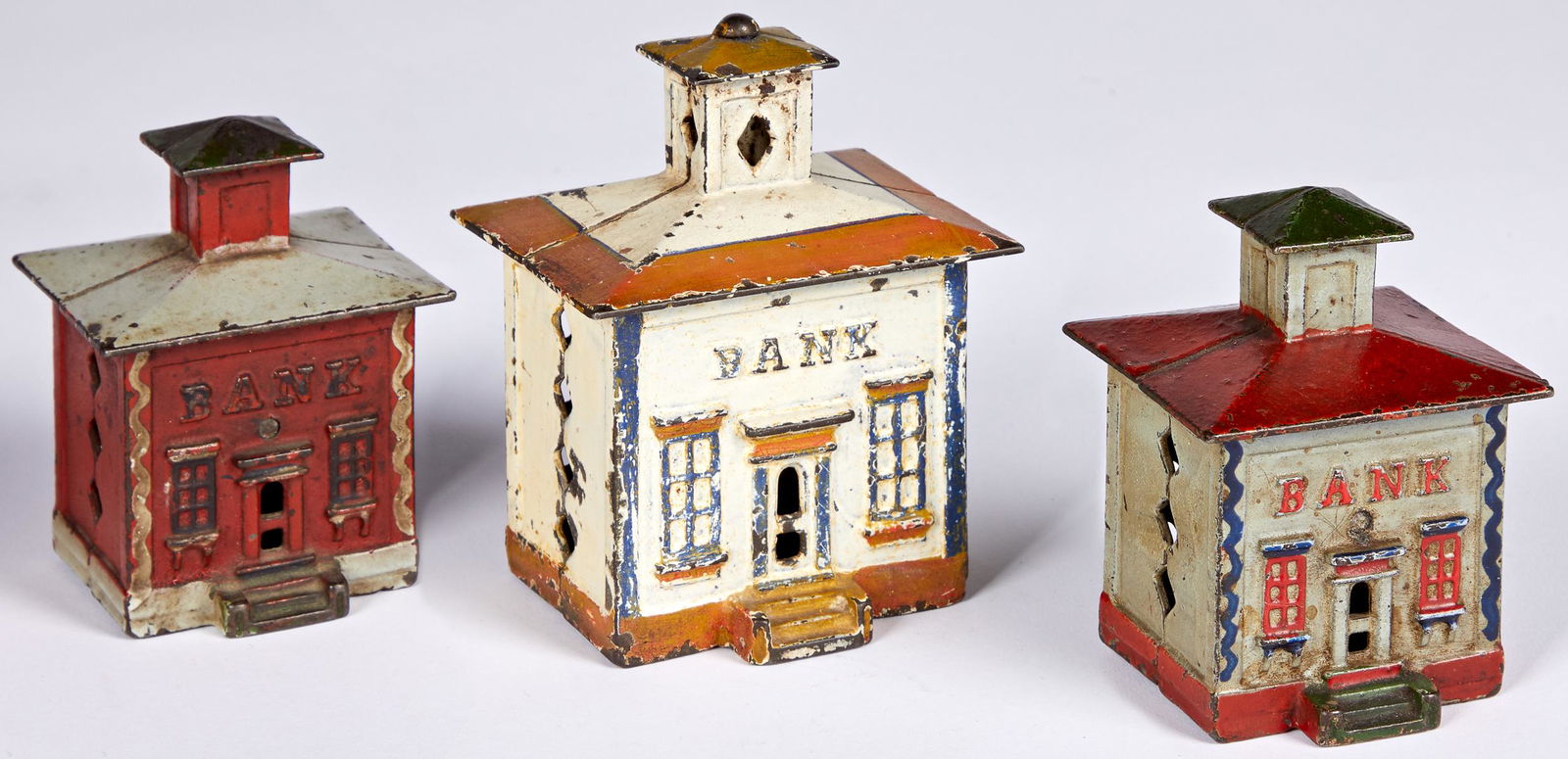 Three J. & E. Stevens cast iron cupola still bank: Three J. & E. Stevens cast iron cupola still banks, tallest - 4 1/4''. Provenance: Collection of Bill and Stevie Weart.