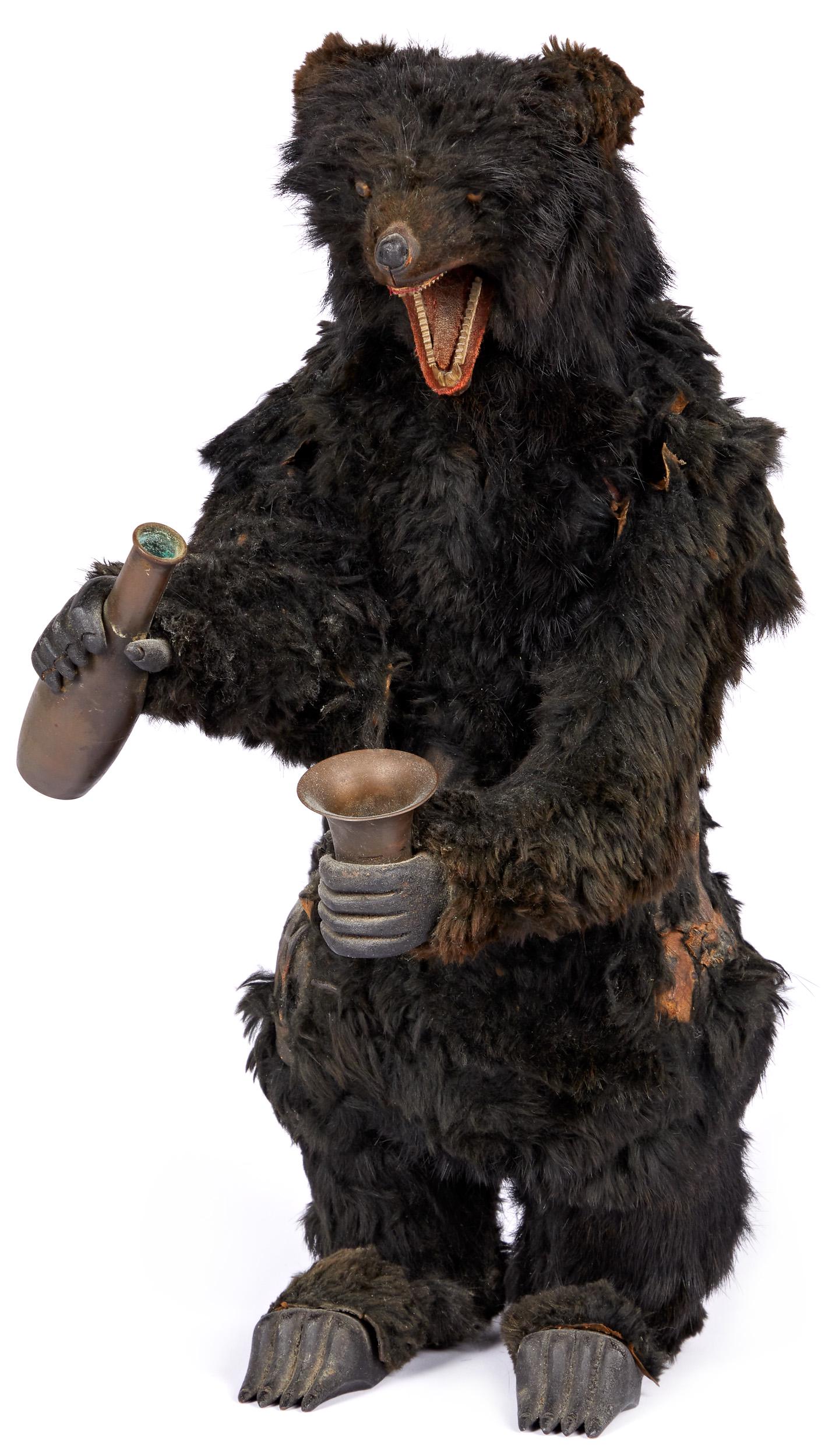 Decamps clockwork fur covered drinking bear: Decamps clockwork fur covered drinking bear, with open mouth, having a row of carved wooden teeth, with wood paws, 16'' h.
