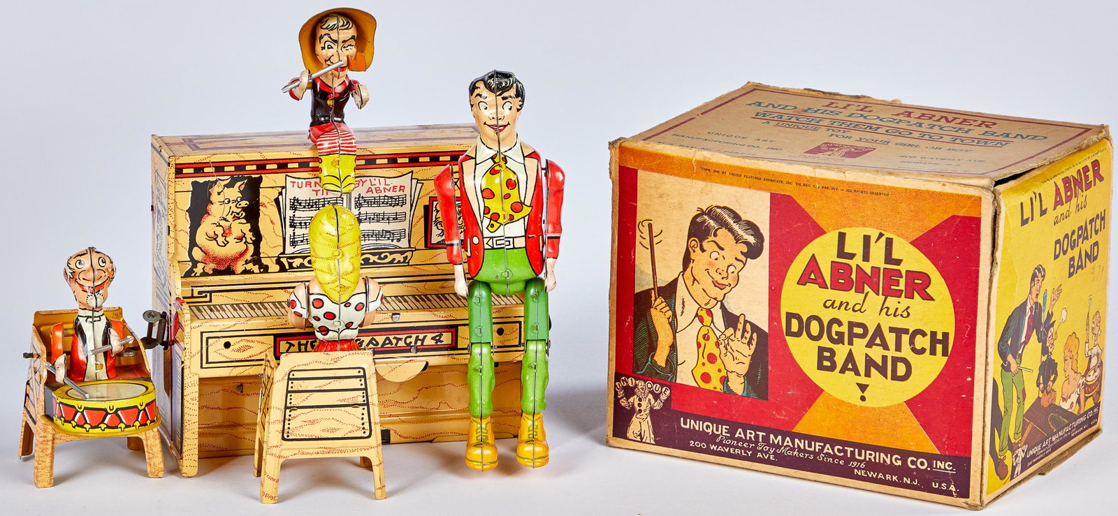 Unique Art Li'l Abner and his Dogpatch Band: Unique Art tin lithograph wind-up Li'l Abner and his Dogpatch Band, in the original box, 8'' h.
