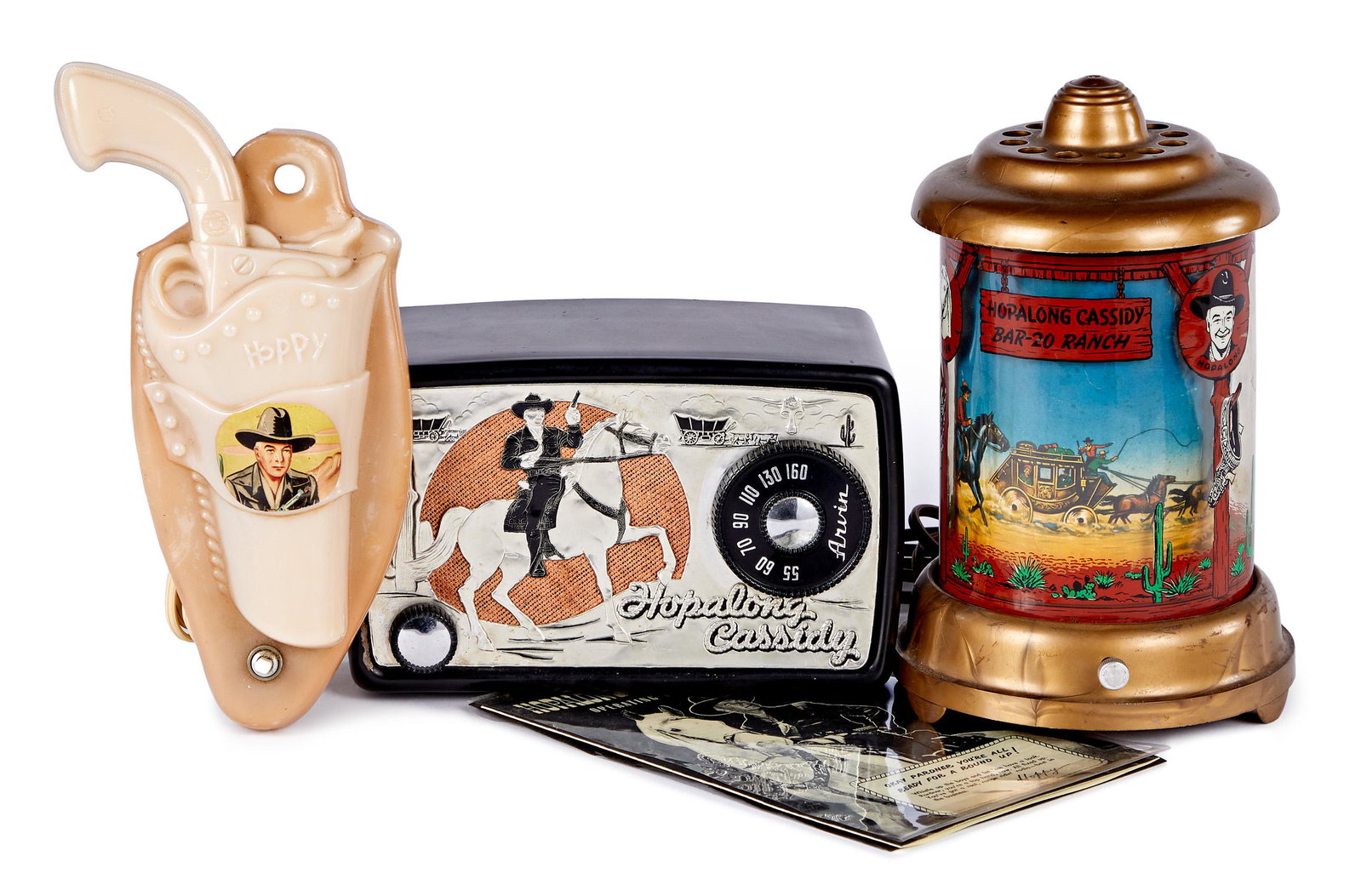 Group of Hopalong Cassidy items - radio & lamps: Group of Hopalong Cassidy items, to include a nice Arvin Hoppy radio with instruction sheet, 5 1/4'' h., a Bar-20 Ranch motion lamp, and a molded slag glass night light in the shape of a gun in a hols