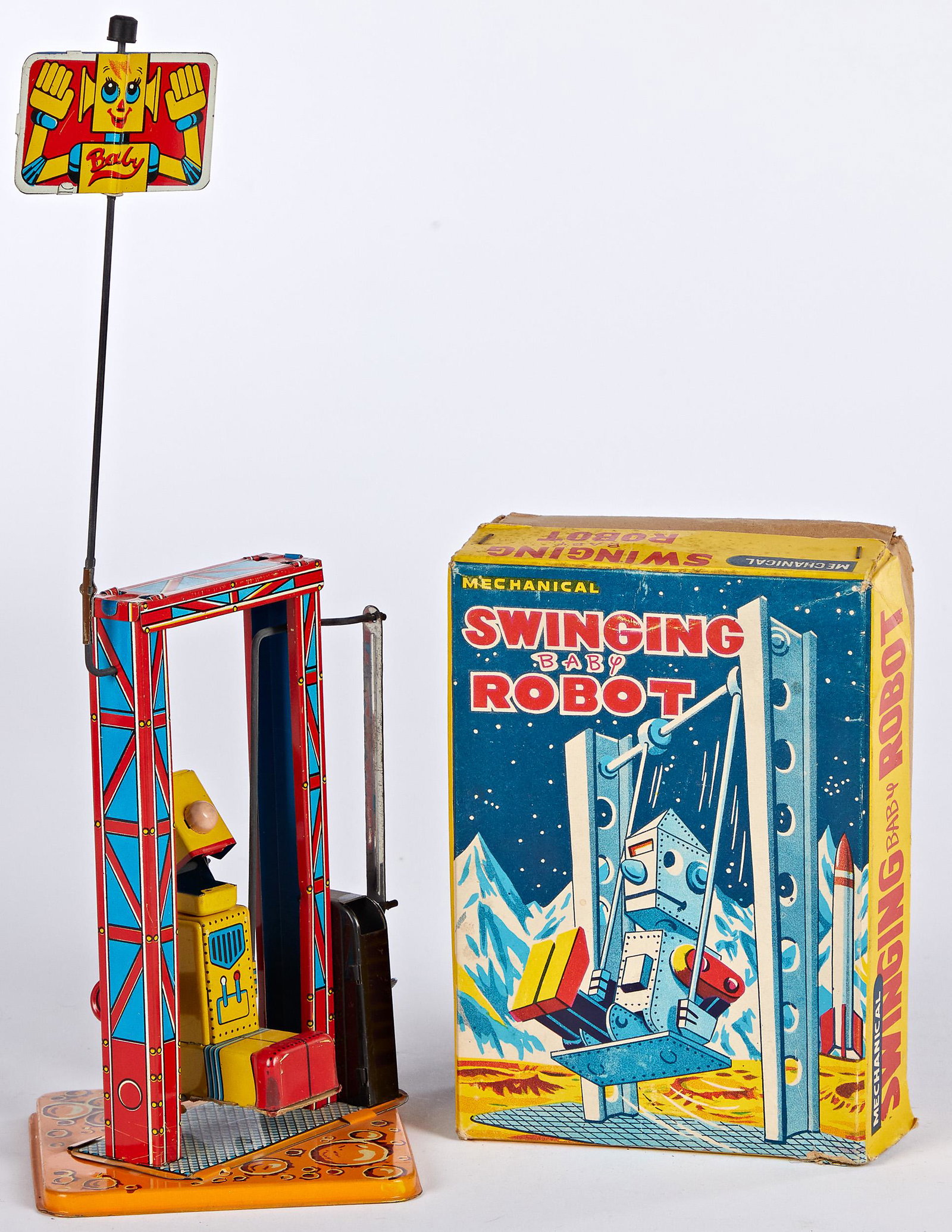 Japanese Swinging Baby Robot wind-up: Japanese tin lithograph wind-up Swinging Baby Robot, in the original box, 12'' h.