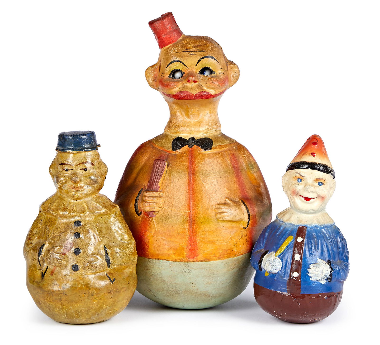 Three Schoenhut Rolly Dolly toys: Three Schoenhut painted composition Rolly Dolly toys, to include Happy Hooligan, with articulated glass eyes which move side to side, 10'' h., together with two clowns, 6 1/4'' h.
