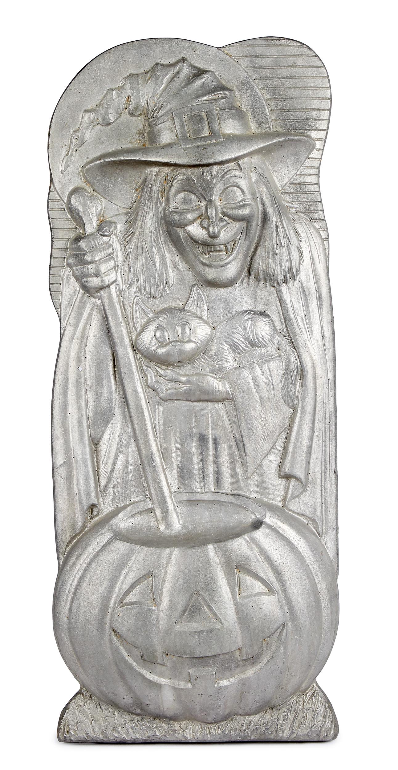 Unusual cast aluminum Halloween witch plaque: Unusual cast aluminum Halloween plaque, of a witch stirring a Jack-O-Lantern kettle, with a cat in her arm, 30 1/2'' h., 12'' w.