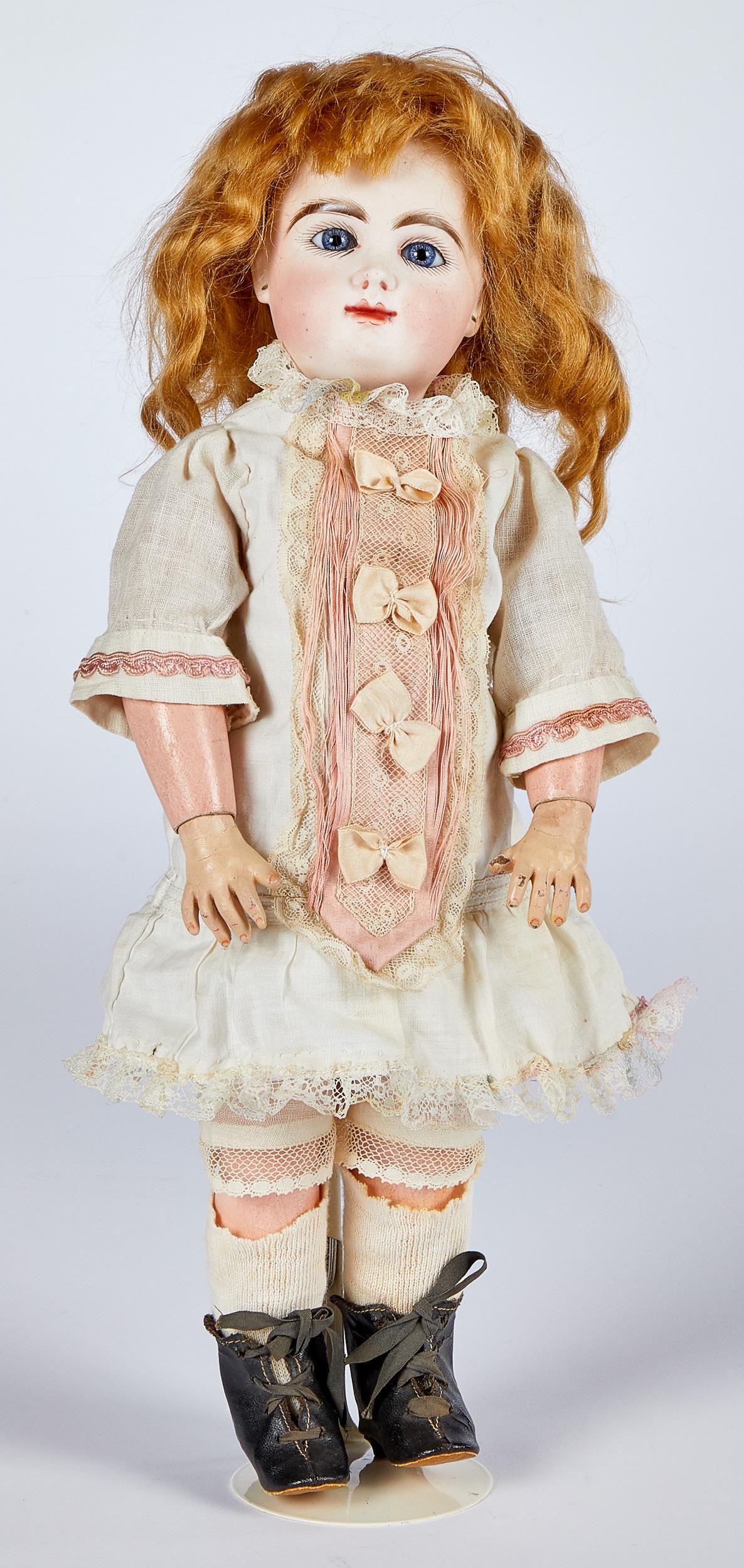 French Rabery & Delphieu bisque head walker doll: French Rabery & Delphieu bisque head walker doll, the socket head incised R 2/0 D, with blue glass paperweight eyes, painted long lashes and feathered brows, dimpled chin, pierced ears, closed mouth,