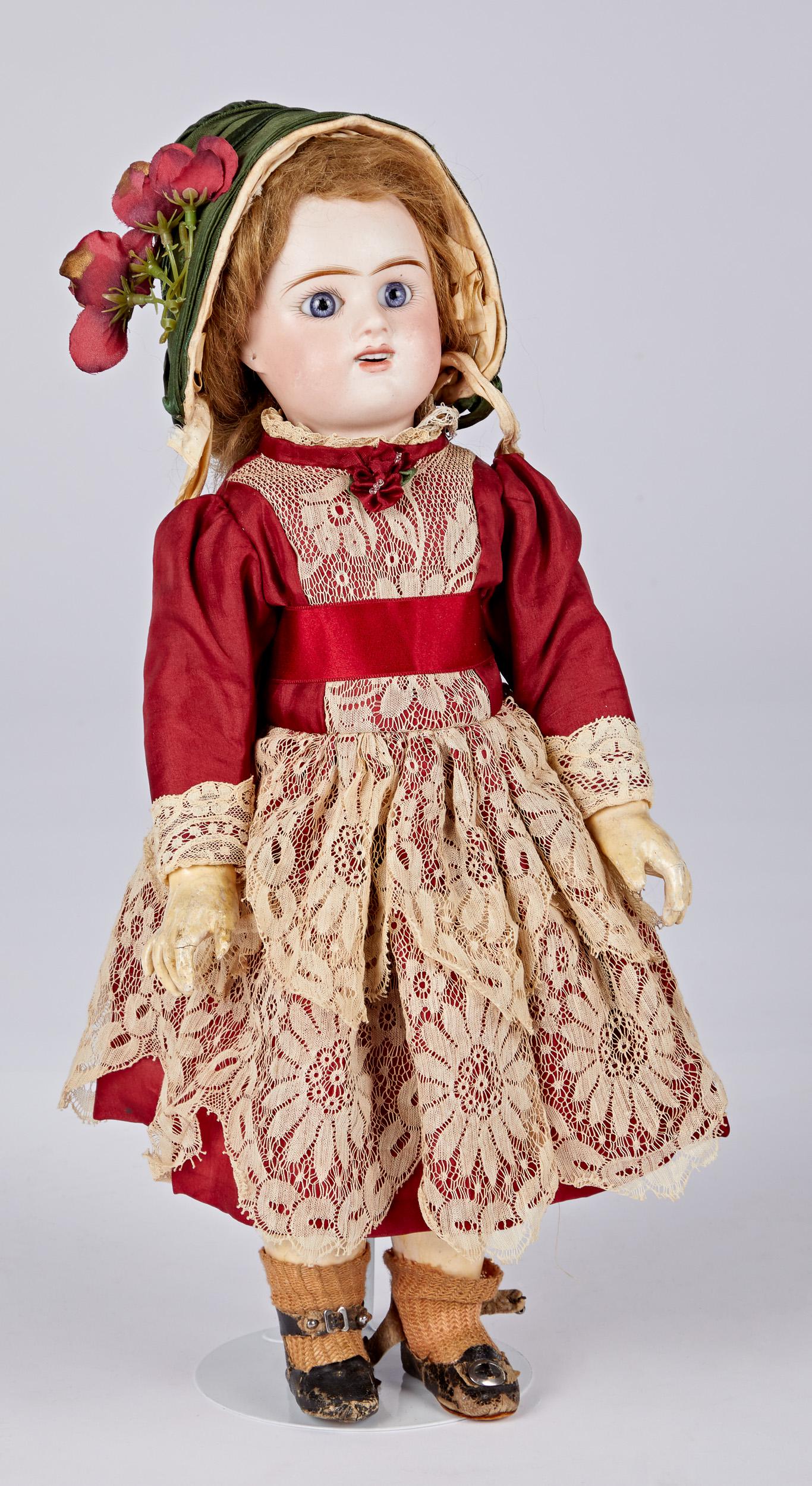 French bisque head Bebe doll by Etienne Denamur: French bisque head Bebe doll by Etienne Denamur, the socket head incised E 6 D Depose, with blue glass paperweight eyes, painted lashes and brow, open mouth with upper row of teeth, pierced ears, moha