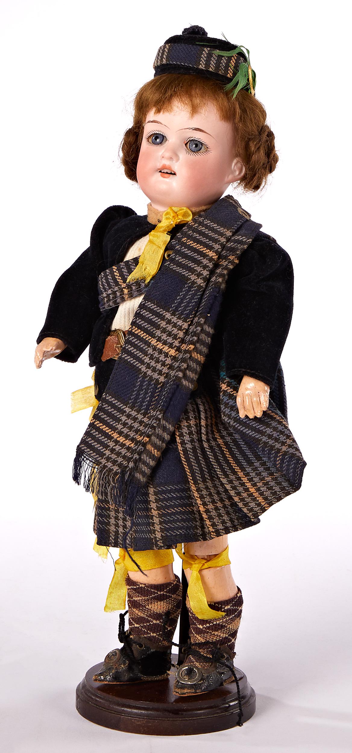 A.M. Floradora doll: A.M. Floradora bisque head doll, with socket head incised Made in Germany Floradora A 5/0 M, blue glass stationary eyes, open mouth with upper teeth, painted lashes and brows, and jointed wood composi