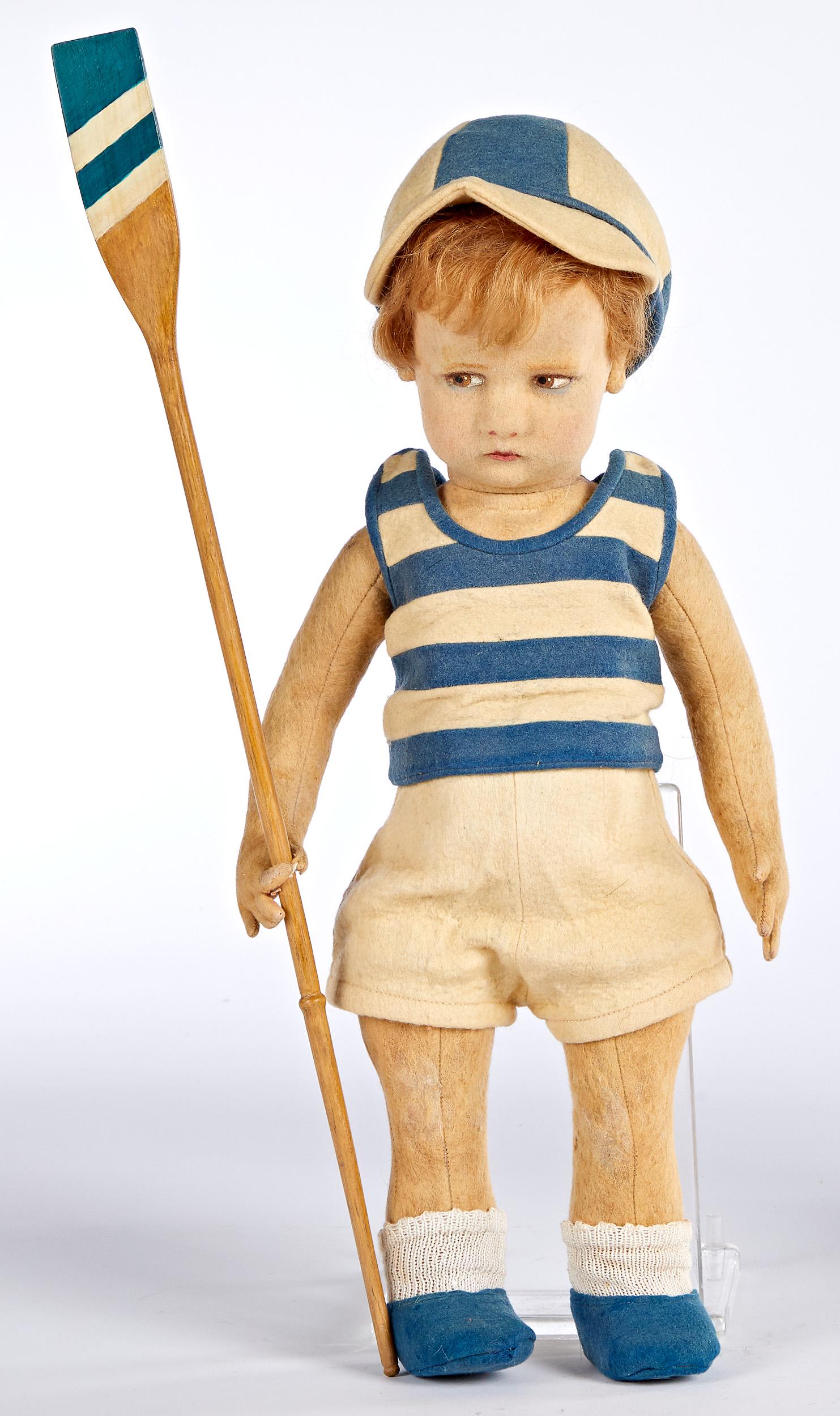 Lenci sport series rower felt doll: Lenci sport series rower felt doll, with hollow torso, swivel head, painted side glancing almond shaped eyes, closed mouth, in uniform with wooden oar, 17'' h.