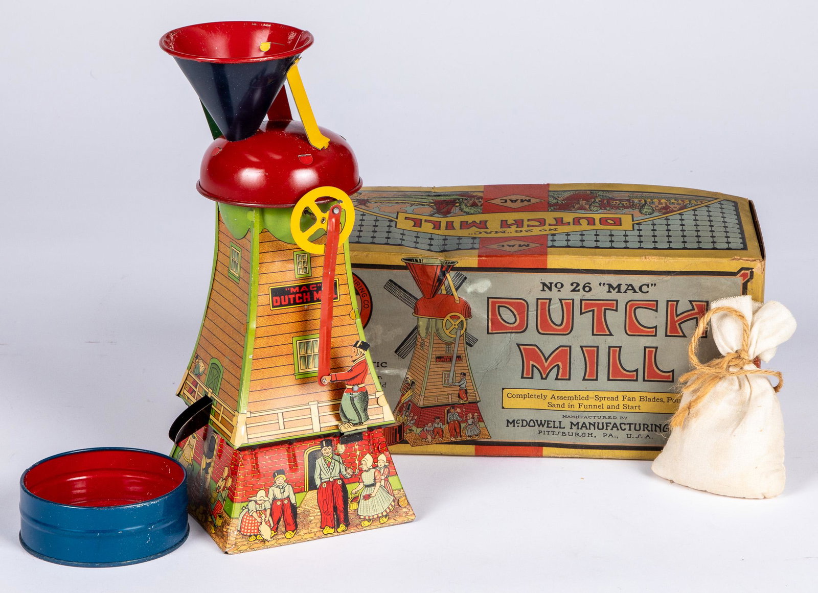 MAC Toys Dutch Mill tin lithograph sand toy: MAC Toys Dutch Mill tin lithograph sand toy in the original box, together with two hand written notes to ''Stanley'' from Aunt Stella discussing the toy as a gift, 11 1/2'' h.
