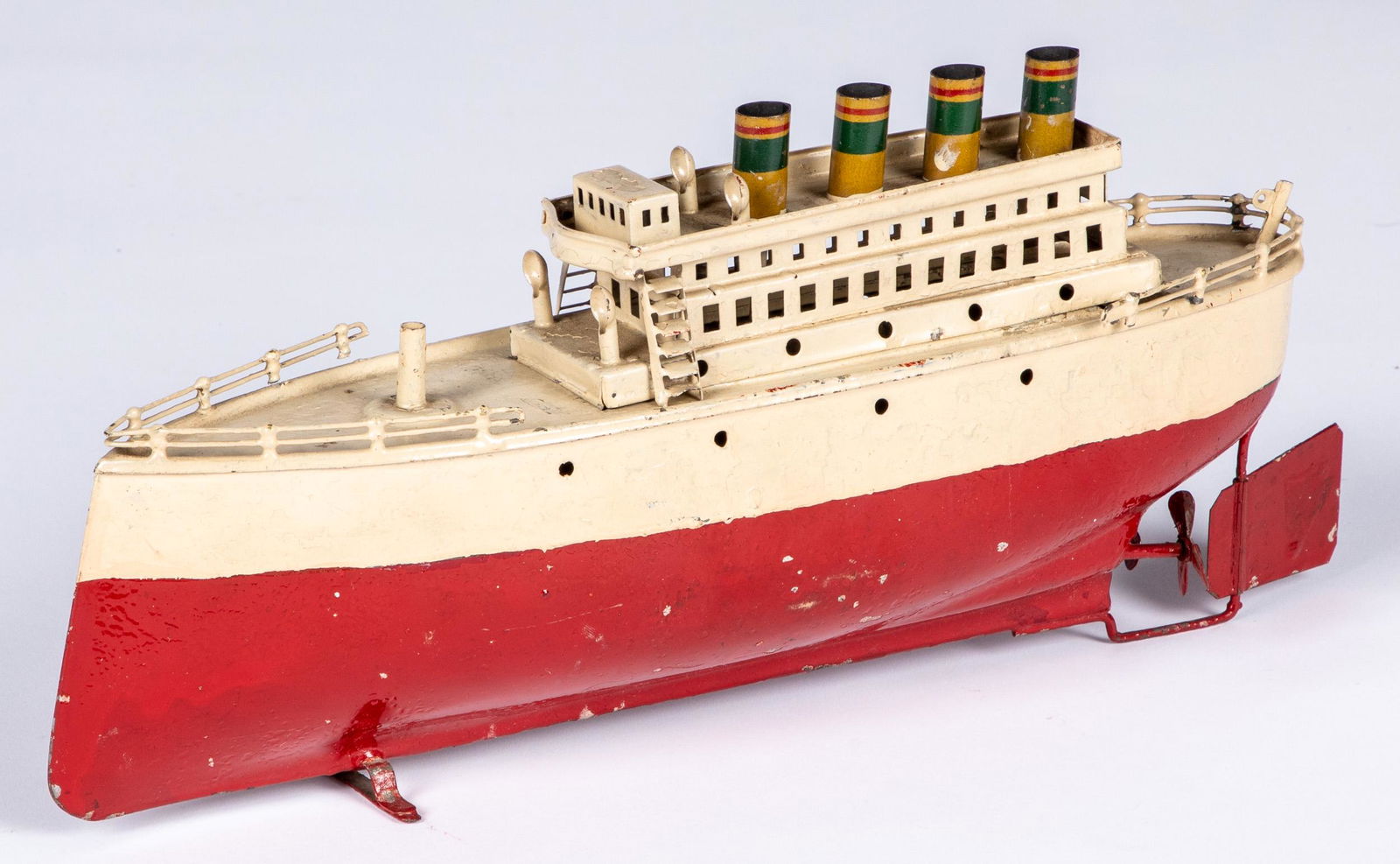 Painted tin clockwork ocean liner: Painted tin clockwork ocean liner, probably Arnold, with four stacks, 13 1/4'' l.