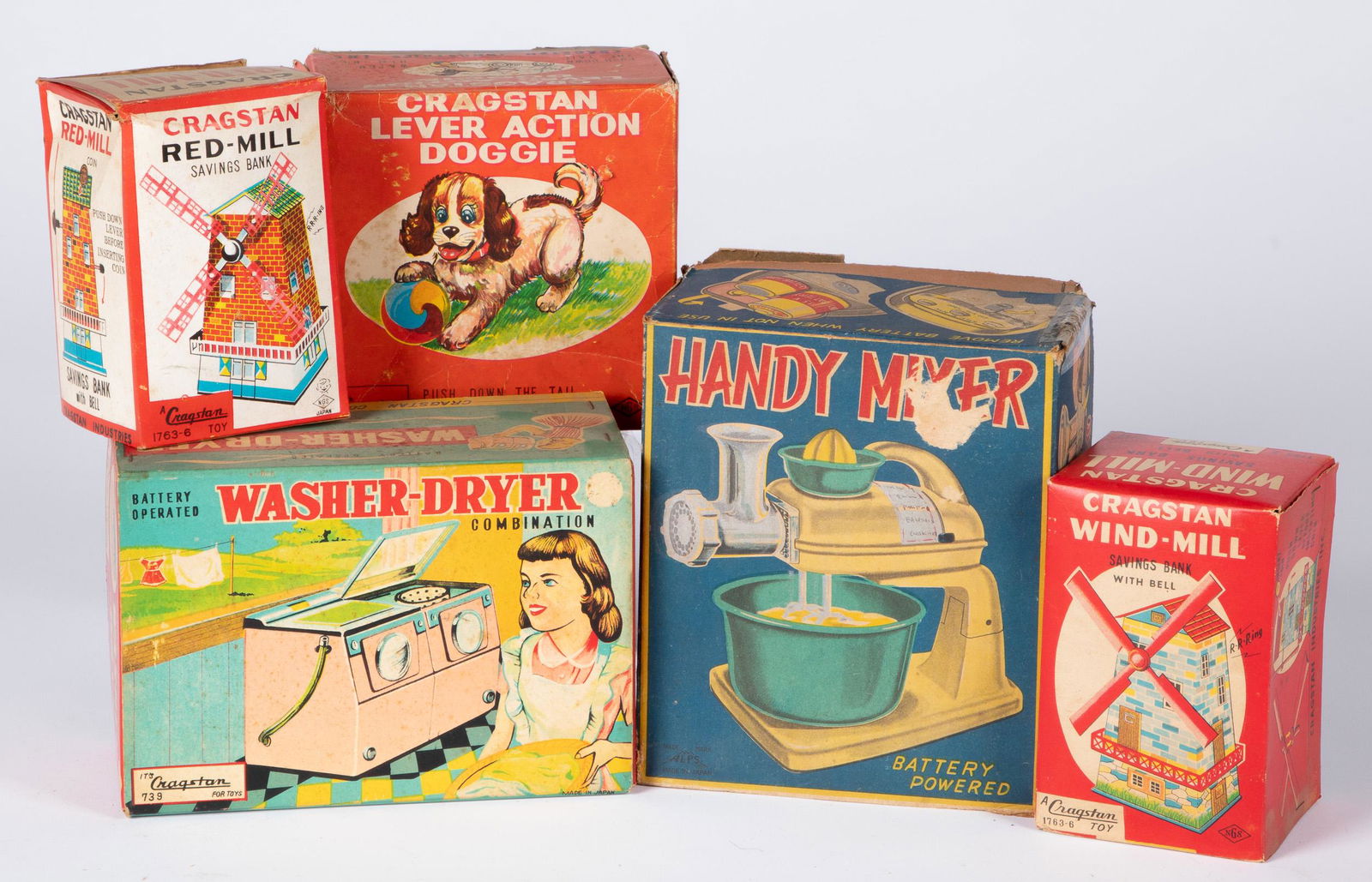 Group of Cragstan mechanical toys: Group of Cragstan mechanical toys, with original boxes, to include Lever Action Doggie, Wind Mill bank, Red Mill bank, Washer Dryer, and Handy Mixer.
