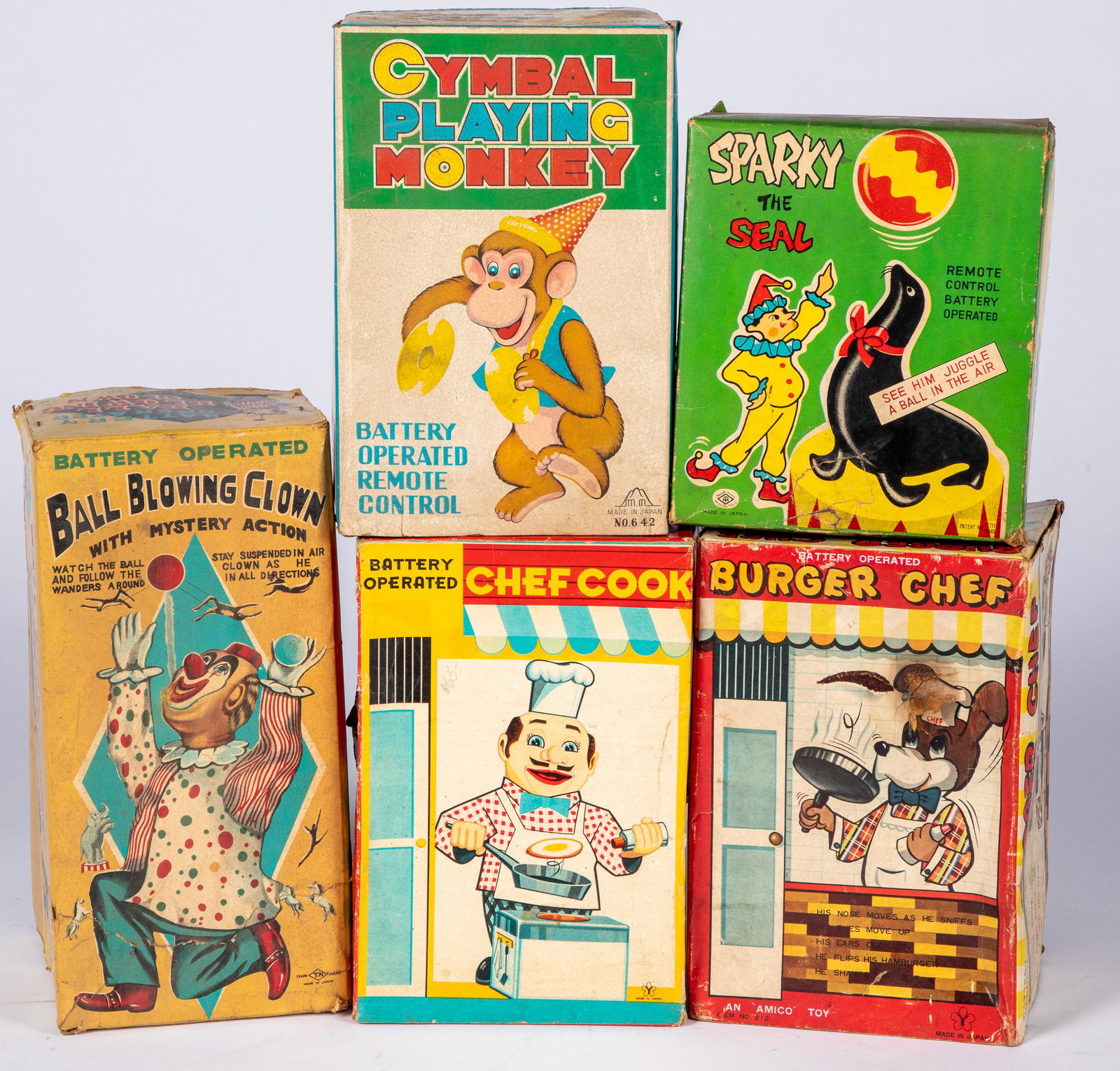 Five battery operated toys: Five battery operated toys, in the original boxes, to include Burger Chef, Chef Cook, Ball Blowing Clown, Cymbal Playing Monkey, and Sparky the Seal.