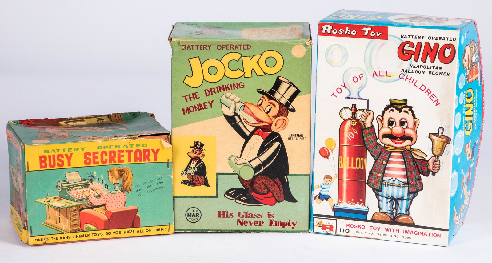 Two battery operated toys, etc.: Two battery operated toys, in the original box, to include Linemar Busy Secretary and Gino, together with an empty box for Jocko the Drinking Monkey.