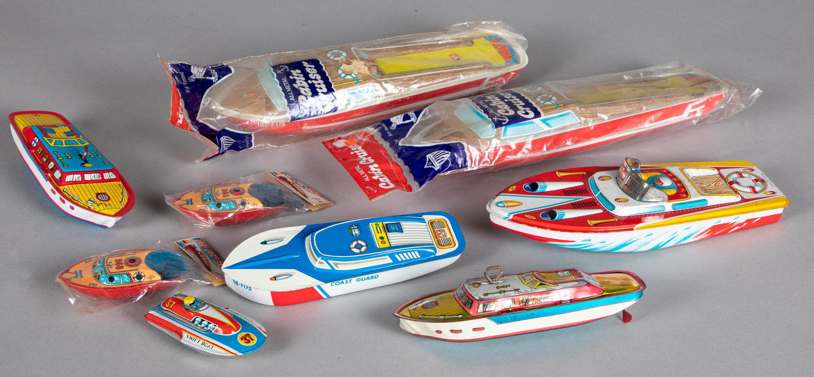 Nine tin lithograph boats: Nine tin lithograph boats, to include Chein, Ohio Art and Japanese, longest - 14 1/4''.