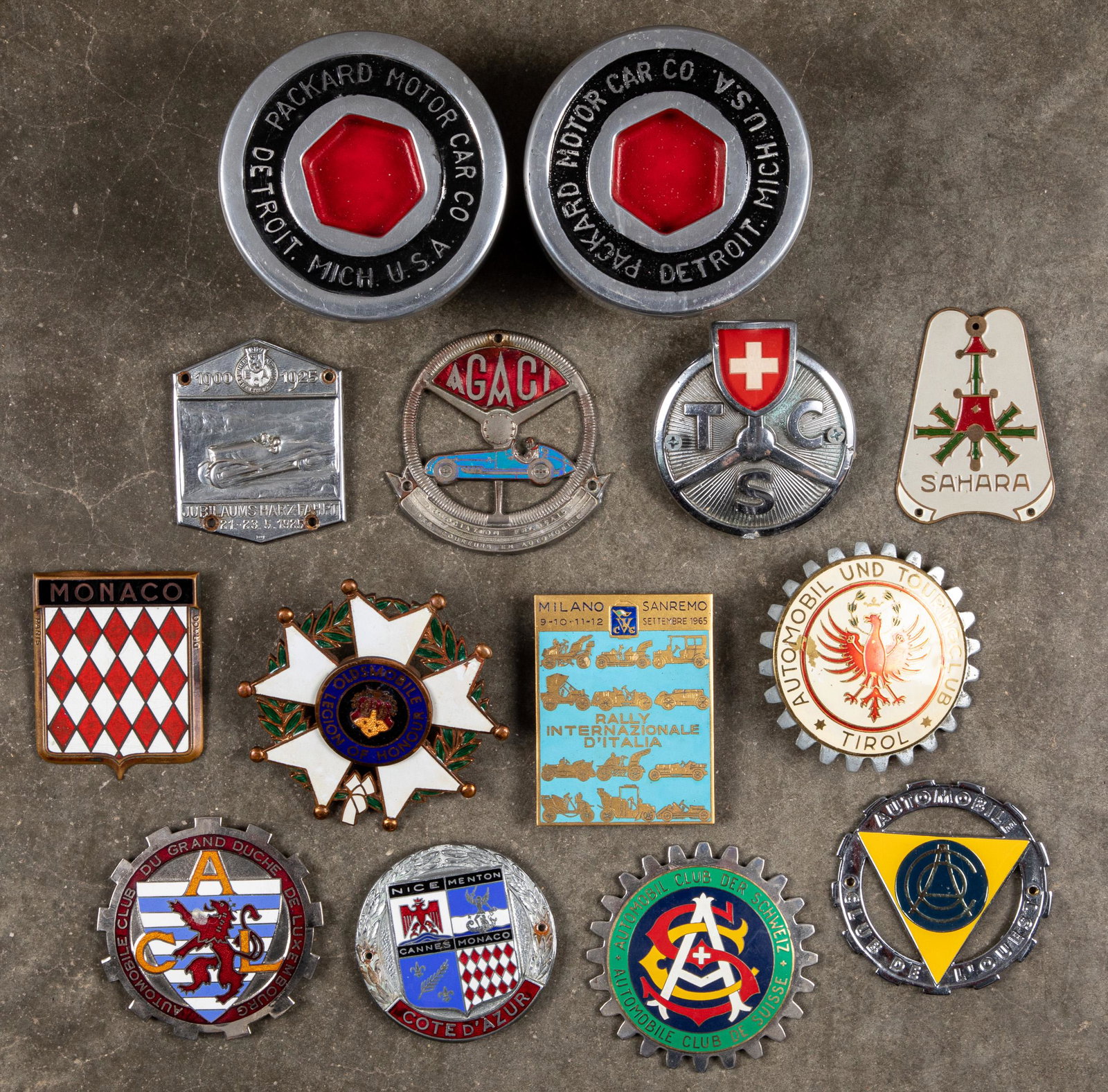 Collection of car license badges: Collection of car license badges, together with two contemporary Packard display pieces.
