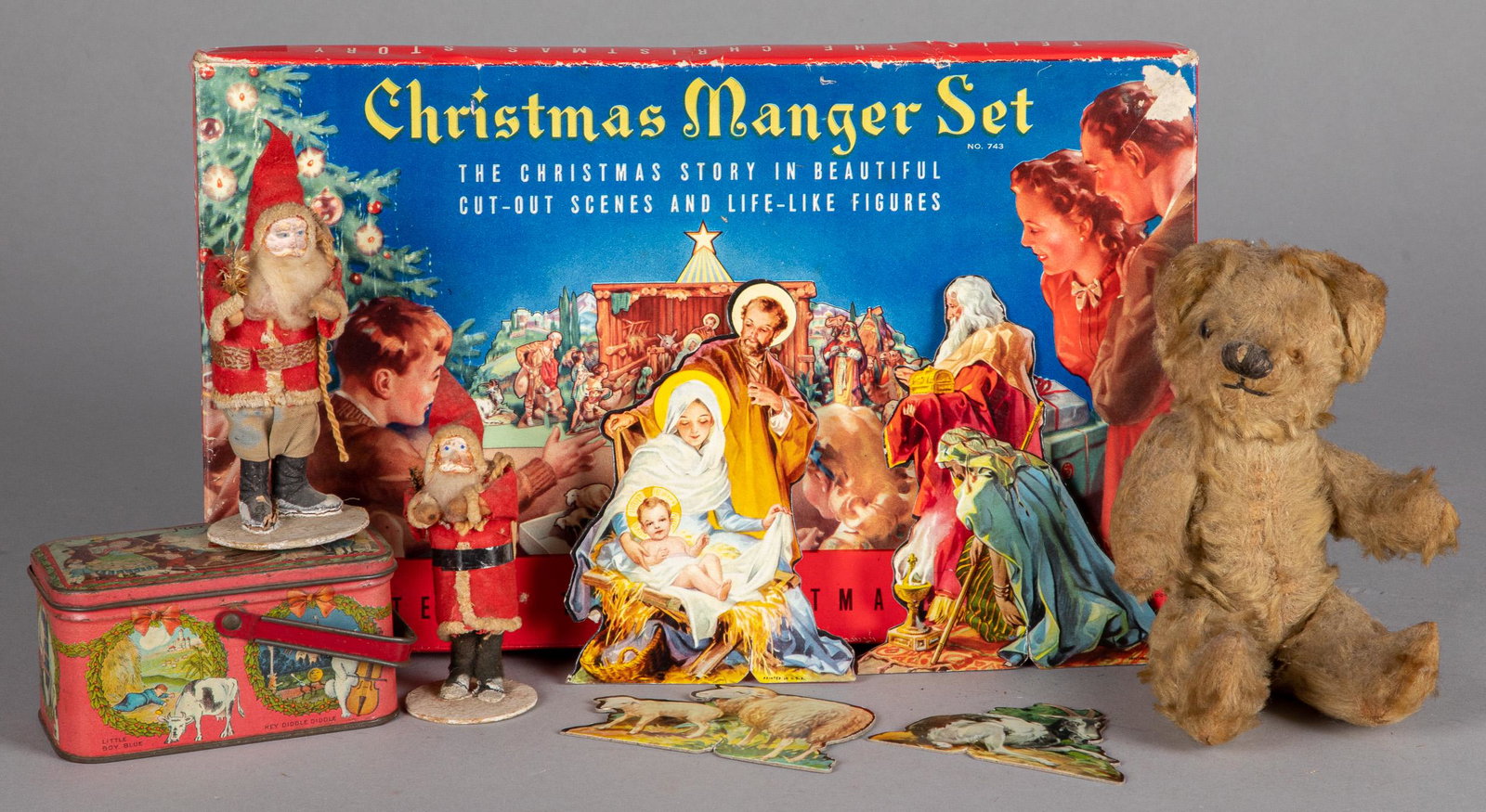 Group of vintage Christmas items: Group of vintage Christmas items, to include a tin lithograph candy tin, Christmas manger set in box, two Santa's, and a mohair teddy bear.