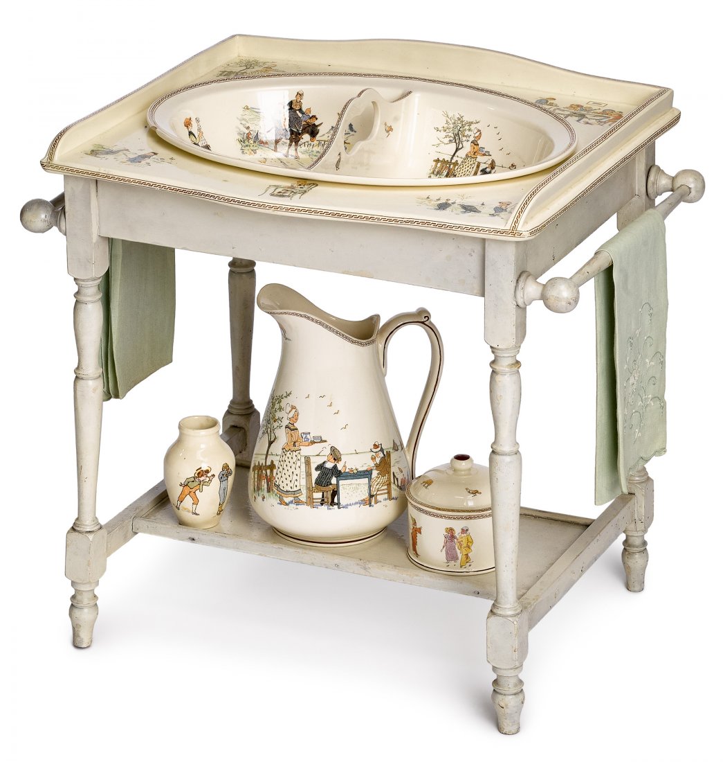 Kate Greenaway porcelain wash stand: Unusual French Kate Greenaway porcelain wash stand, having a porcelain top with inset divided wash bowl, a pitcher, a covered powder jar, and a small associated vase, stamped {Sarreguemines DV}, with 