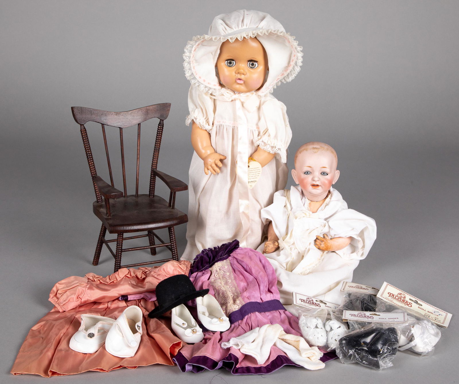 Kestner bisque dome head baby doll, etc.: Kestner bisque dome head baby doll, with blue glass fixed eyes, open mouth with teeth and composition body, 14'' h., together with an Effanbee Dydee doll, doll chair and miscellaneous contemporary clo