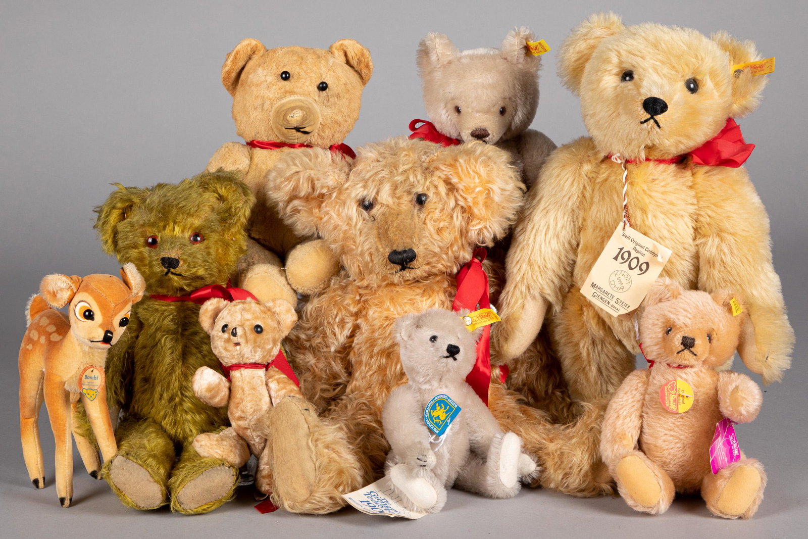 Four vintage teddy bears, etc.: Four vintage teddy bears, together with four contemporary Steiff teddy bears and a vintage Bambi, tallest - 19''.