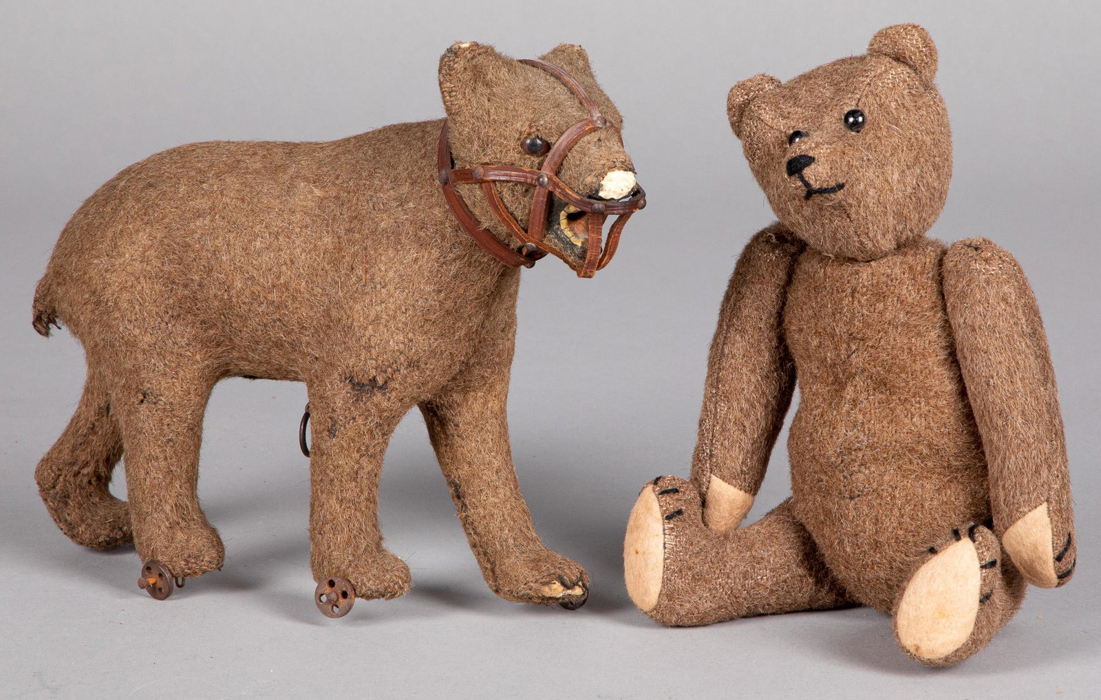 Two mohair teddy bears: Two mohair teddy bears, early 20th c., to include a pull toy with leather muzzle, 10 1/2'' l., the other 12'' h.