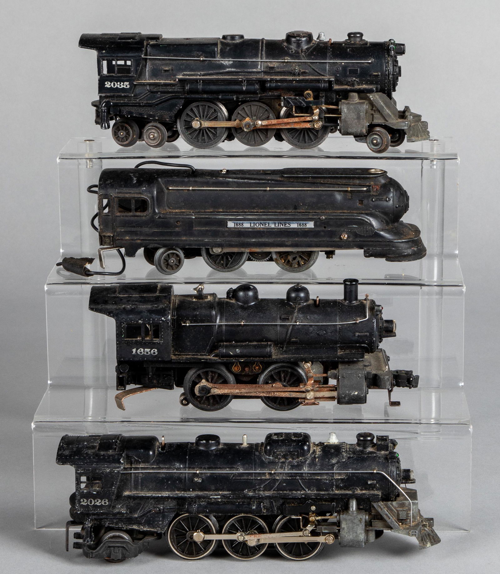 Four Lionel electric train locomotives: Four Lionel electric train locomotives, 0 gauge, to include #1688, #2035, #1656 and #2026.