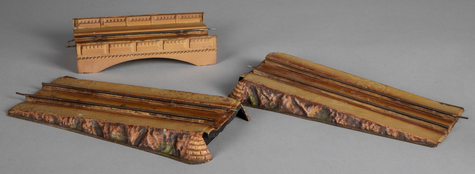 Marklin embossed and painted tin train bridge: Marklin embossed and painted tin train bridge, in three sections, the middle section is 10 1/4'' l.
