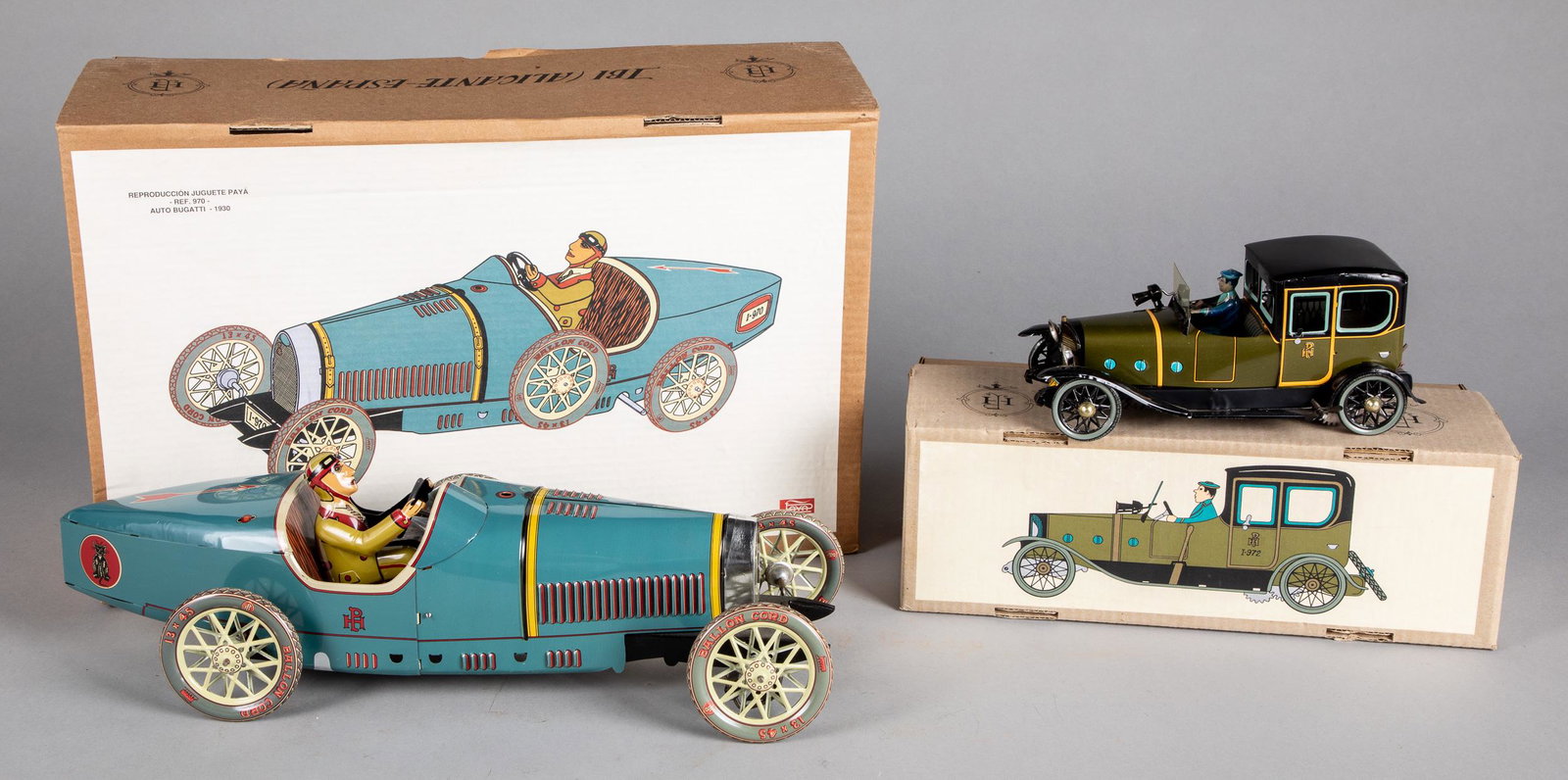 Two contemporary Paya tin lithograph wind-up cars: Two contemporary boxed Paya tin lithograph wind-up cars, to include a large Bugatti and a limousine.
