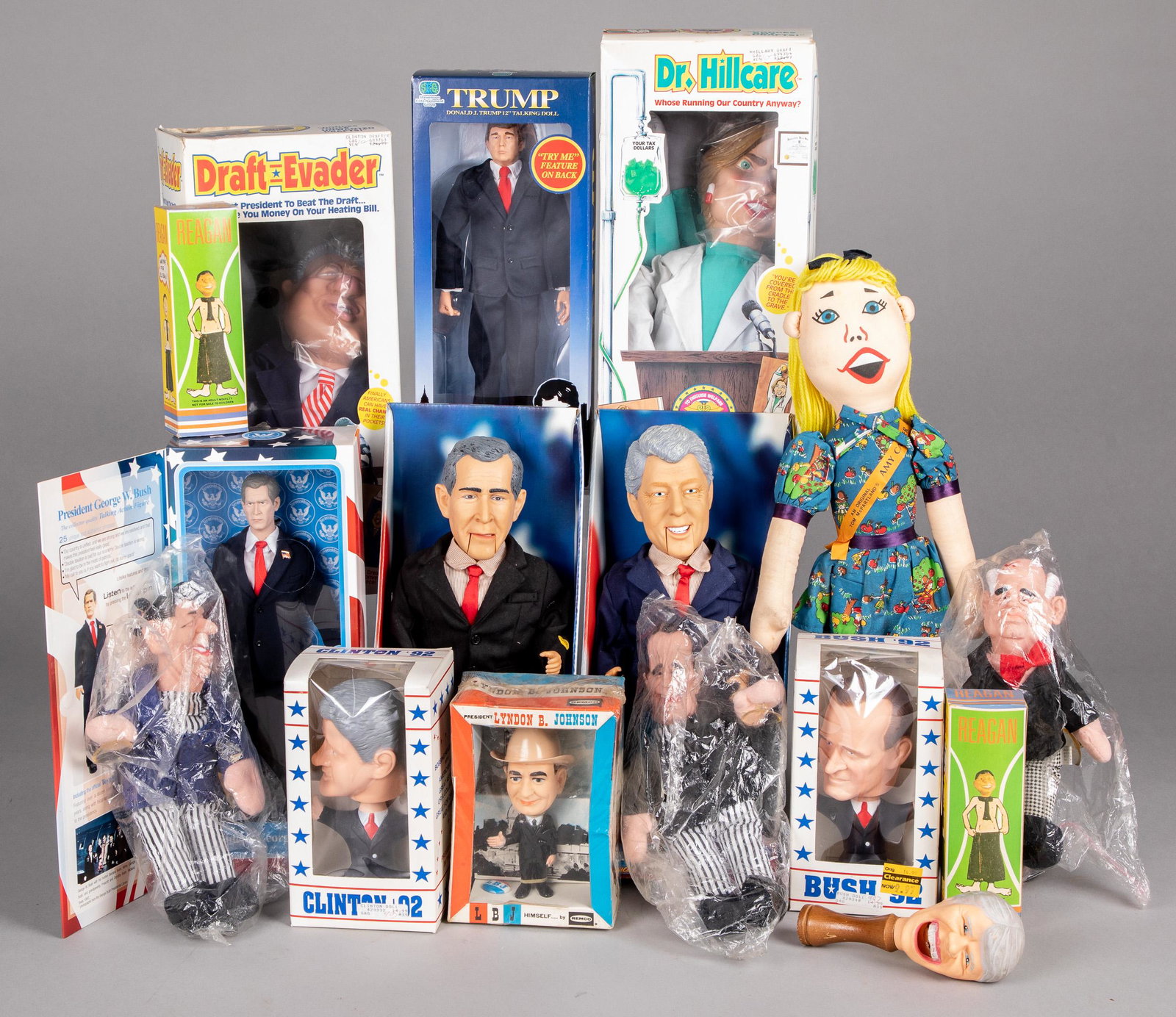 Group of political and presidential dolls: Group of political and presidential dolls, to include George W. Bush, Bill Clinton, '92 Bush bobblehead, 1964 Remco Lyndon B. Johnson, Donald Trump doll, Amy Carter cloth doll, Dr. Hillcare, Draft-Eva