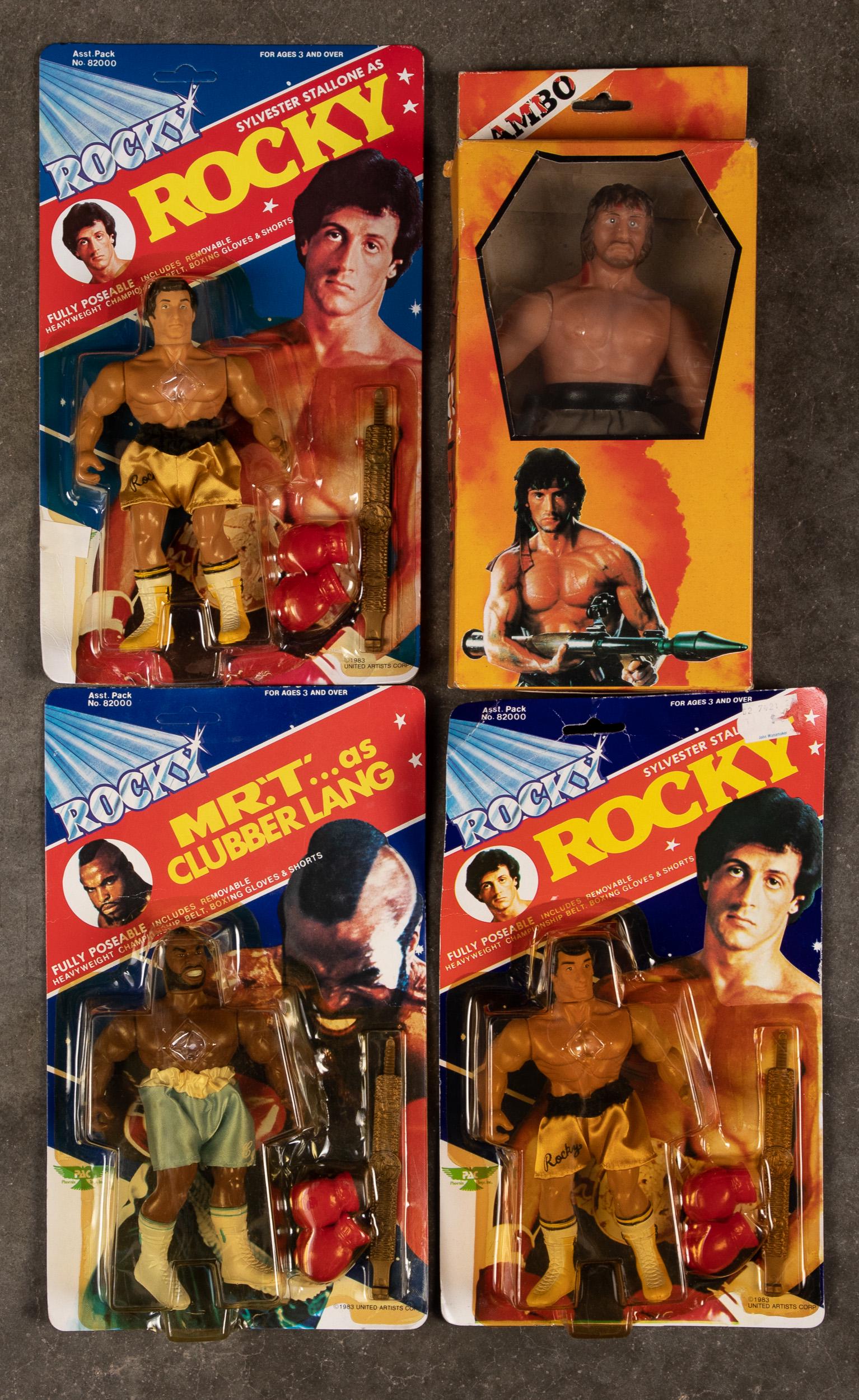Two 1983 PAC Rocky and a Mr. T action figures, et: Two 1983 PAC Rocky and a Mr. T action figures, on original cards, 6 1/4'' h., together with a Rambo part two figure in original box.